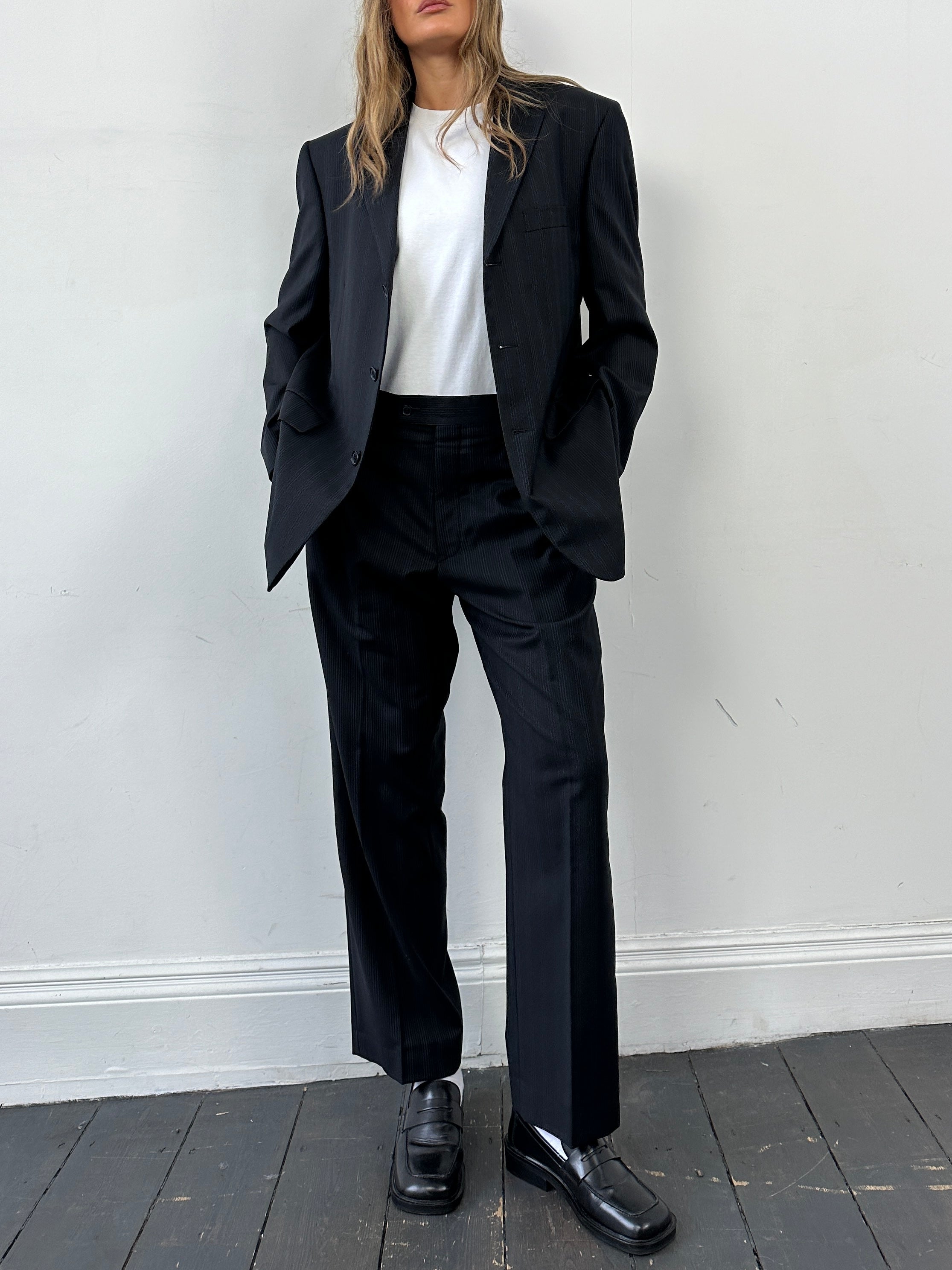 Yves Saint Laurent pinstripe pure wool single-breasted jumpsuit in size 40S/W32, featuring a tailored fit and classic lapel collar.
