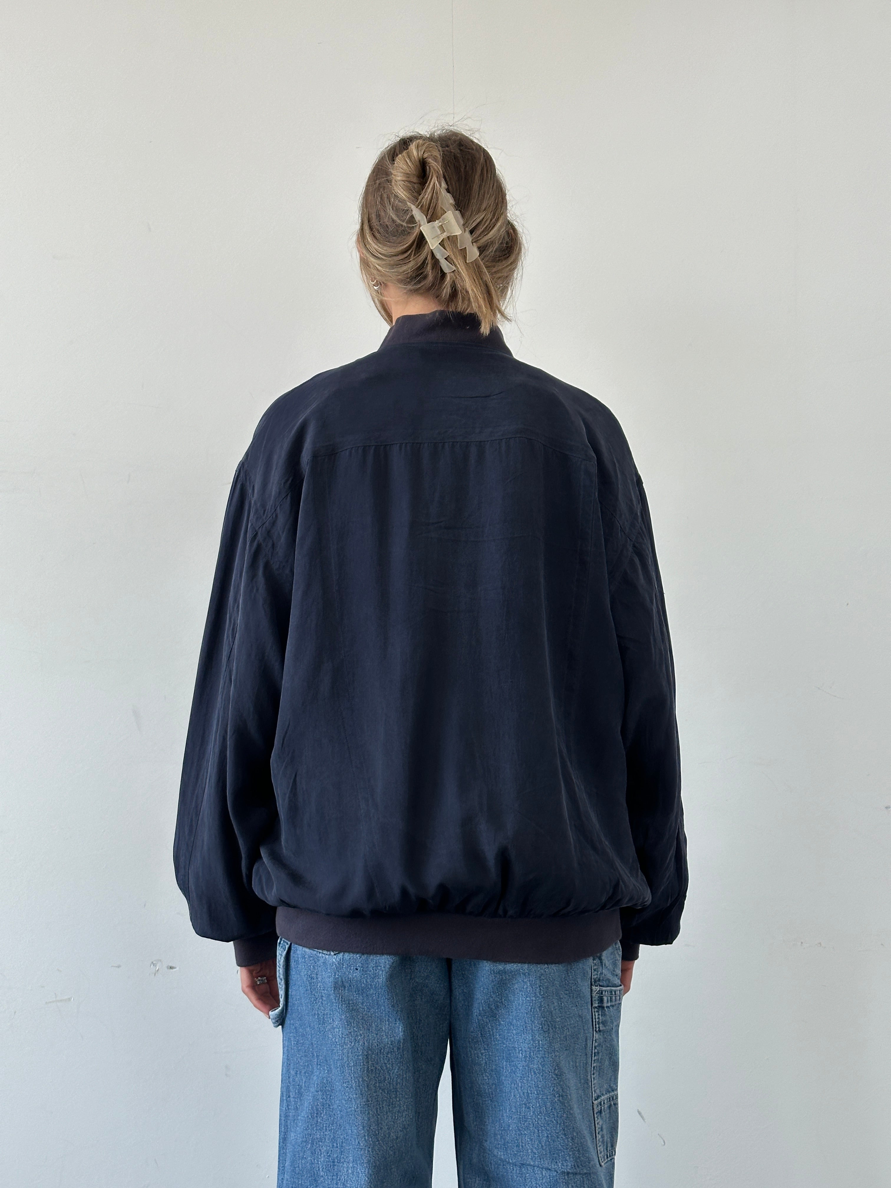 Paul & Shark XXL pure silk bomber jacket with a sleek design, displayed on a hanger.