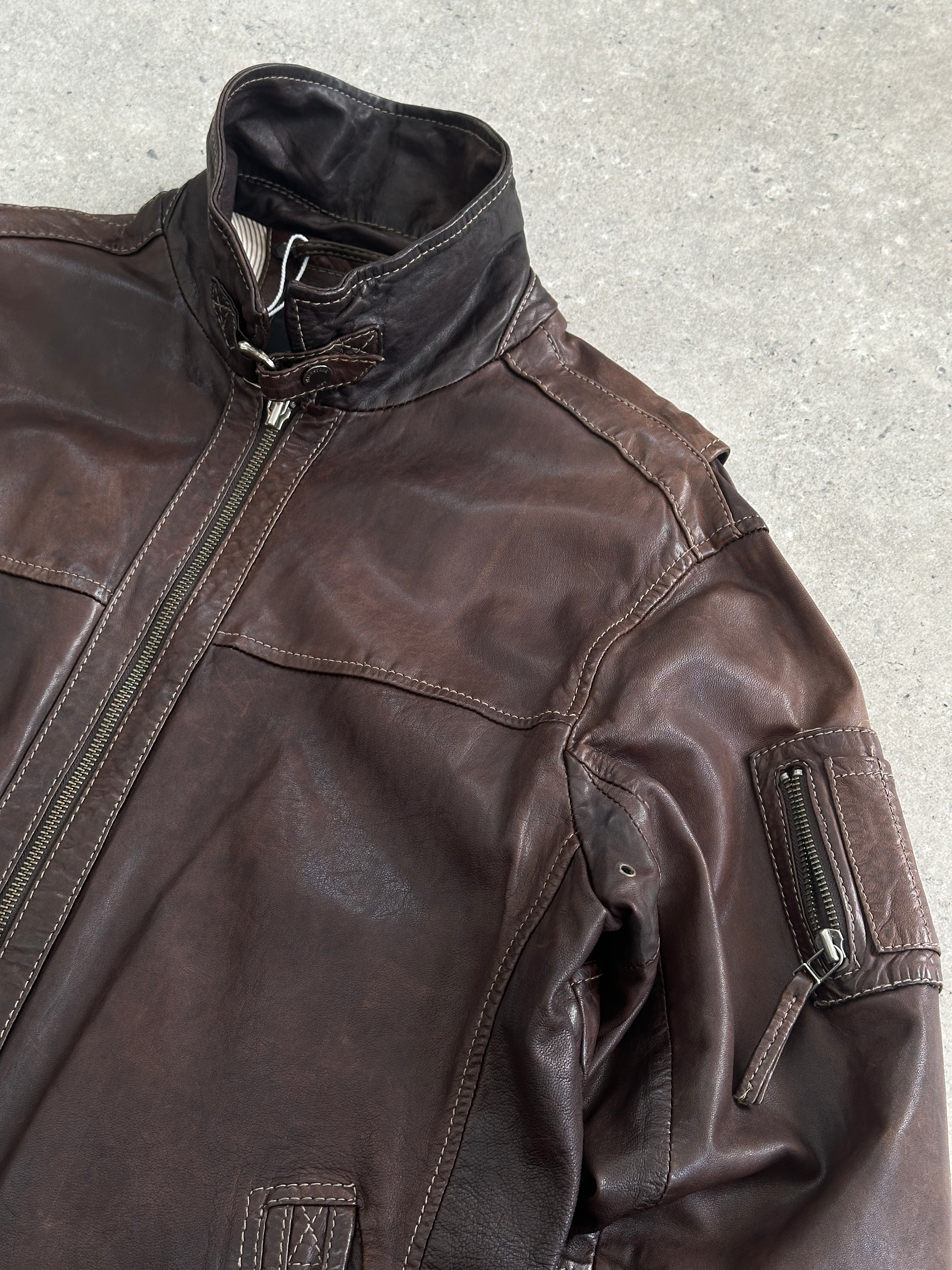 Vintage Moto aged leather jacket in size large, featuring a rugged, vintage style with distressed leather and classic motorcycle design.
