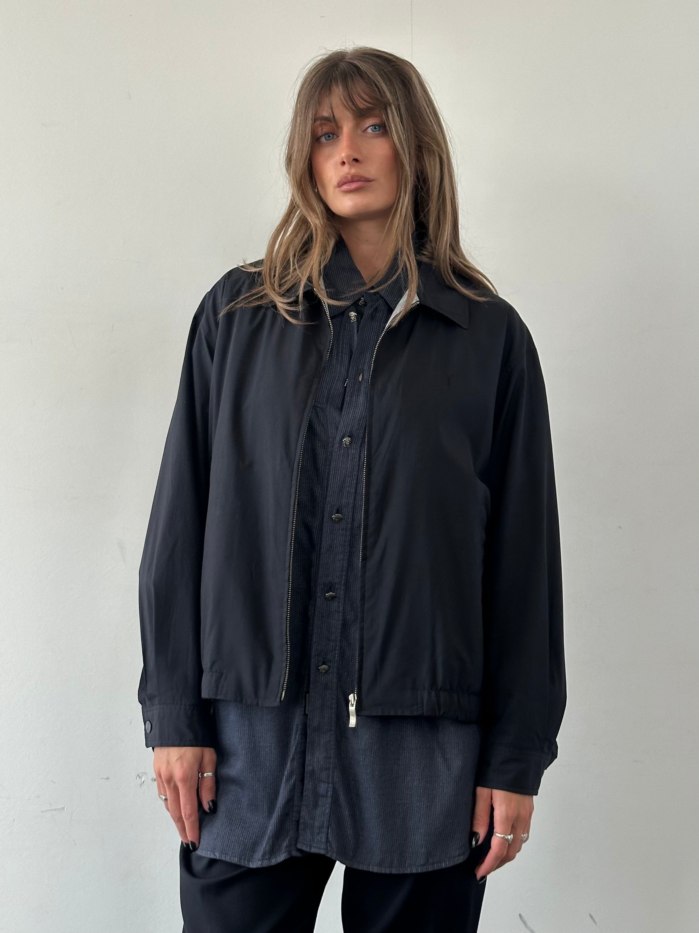 Yves Saint Laurent Pour Homme logo bomber jacket in black, front view showing the branded design and zip closure.