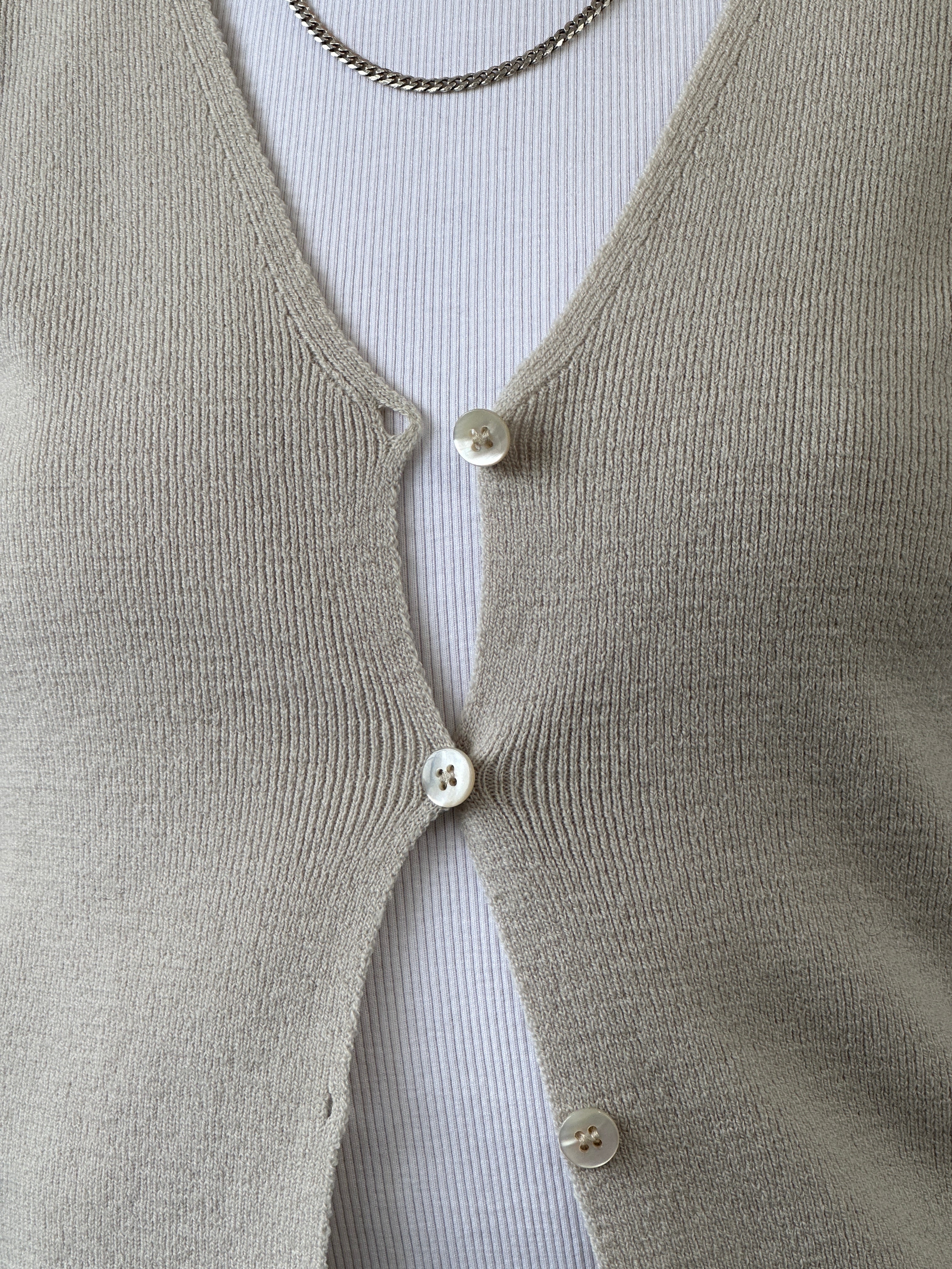 Emporio Armani merino wool cardigan in XXS/XS, featuring a classic knit design and button-front closure.