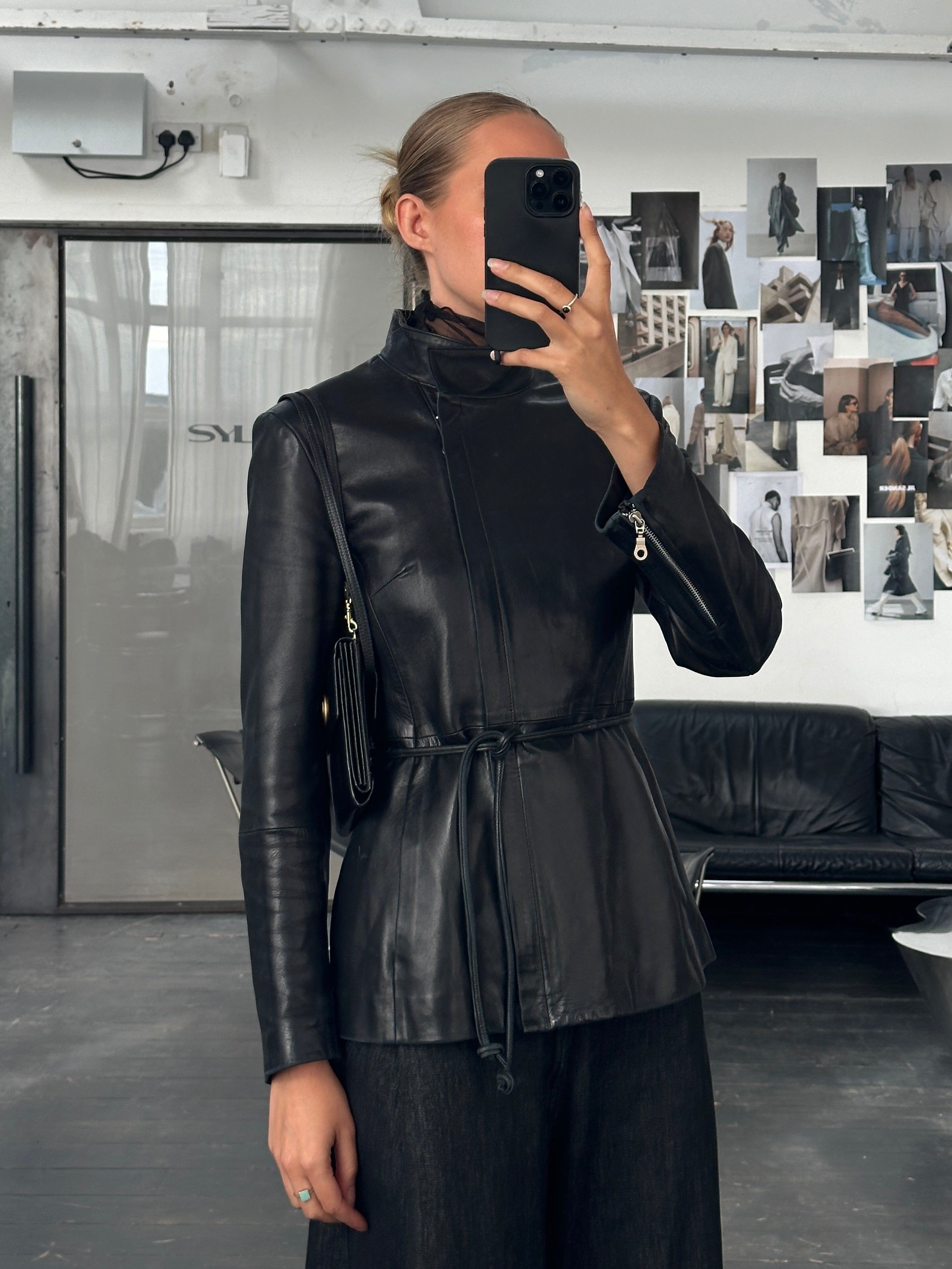 Vintage French 1990s high neck leather jacket with tie belt, classic style, in size S/M, featuring a timeless vintage design.