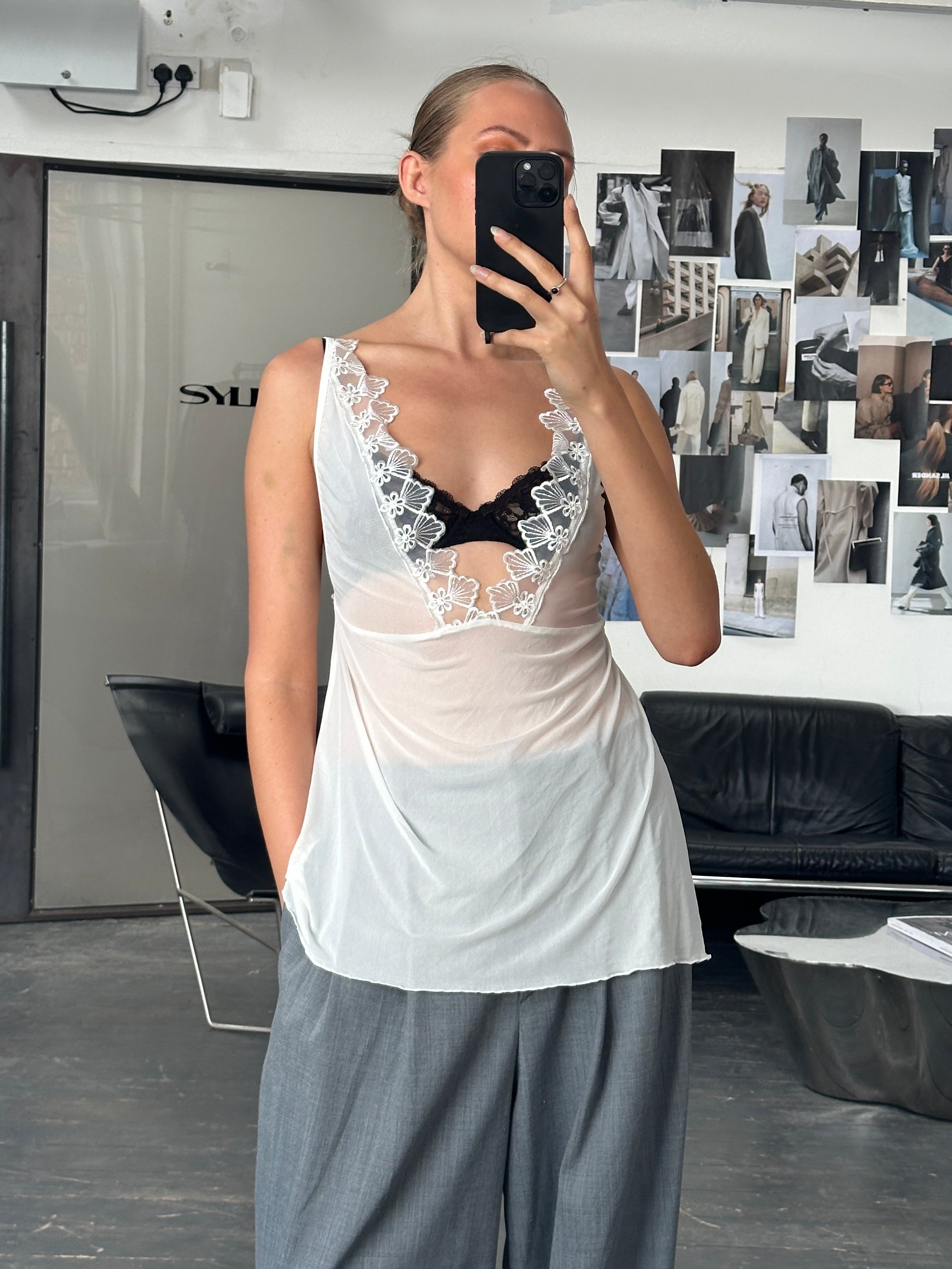 Vintage 2000s lace tank top in M/L size, featuring delicate lace fabric and sleeveless design, casual vintage fashion piece.