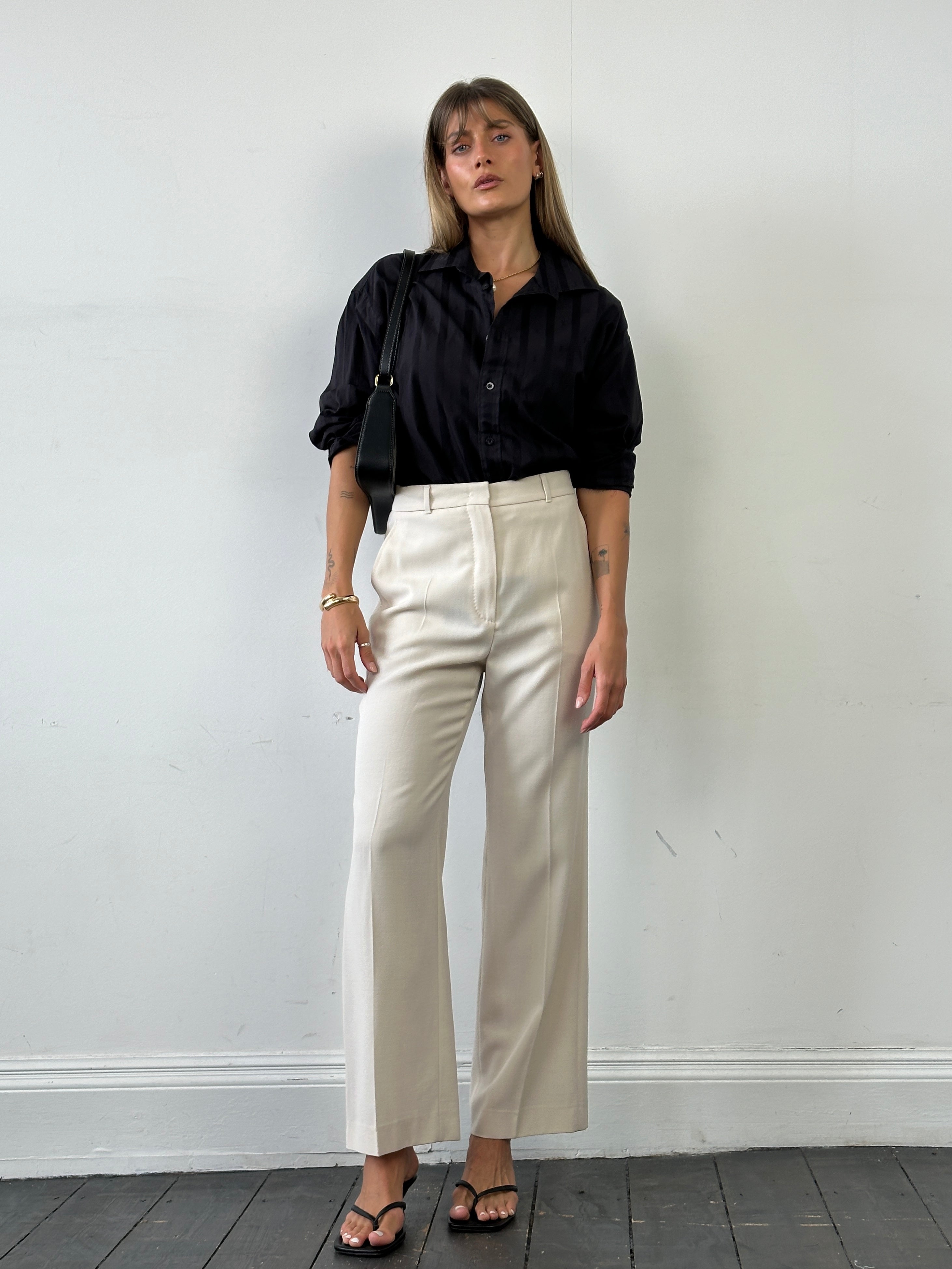 Max Mara high-waisted tailored wool trousers in W28, featuring a sleek fit and classic design, displayed on a neutral background.