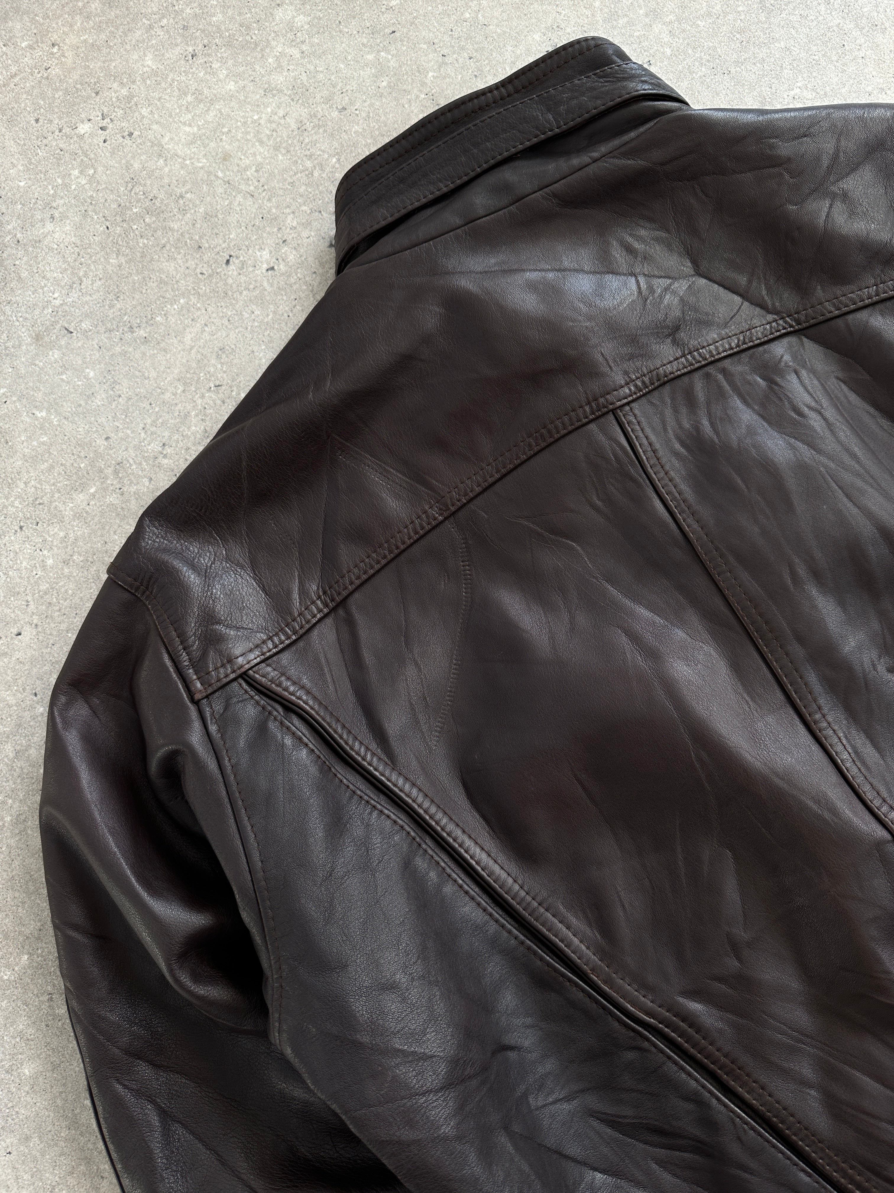 Vintage French 1980s high neck leather bomber jacket, size large, with classic style and authentic distressed leather details.