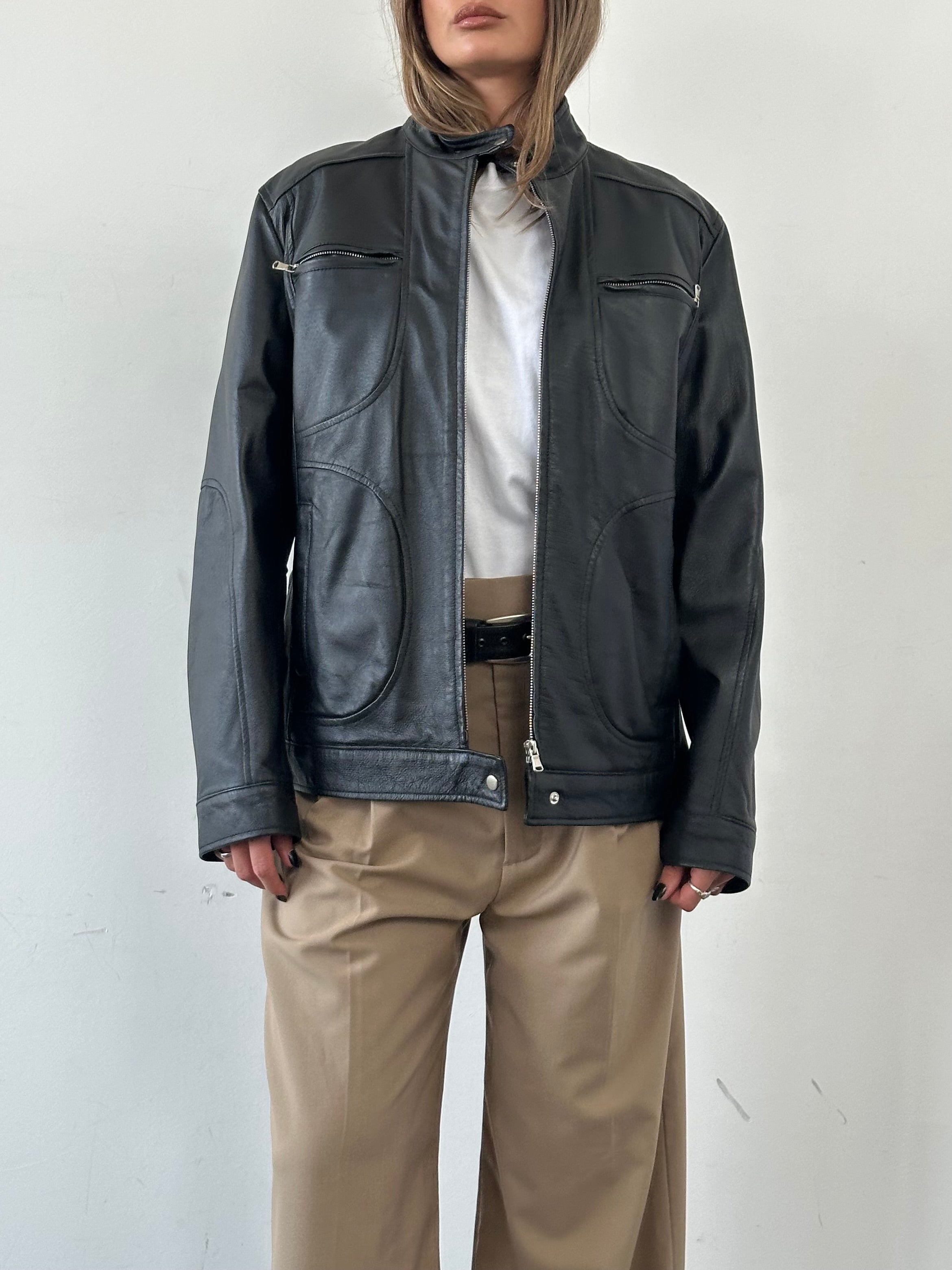 Vintage Moto Leather Jacket in size M/L, featuring classic black leather with silver hardware and a fitted design.
