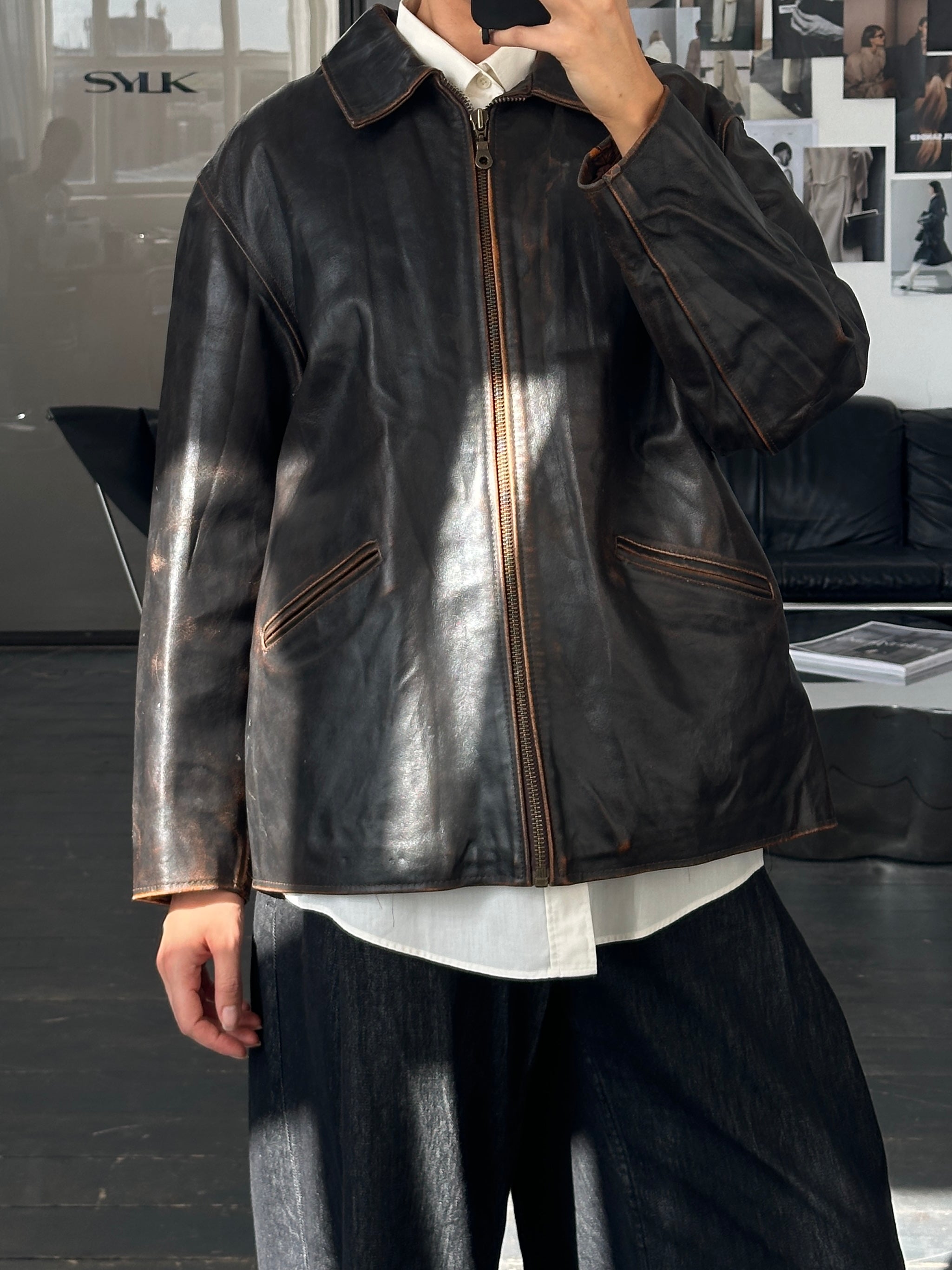 Vintage Italian 1990s distressed leather jacket, L/XL size, featuring rugged texture and classic design.