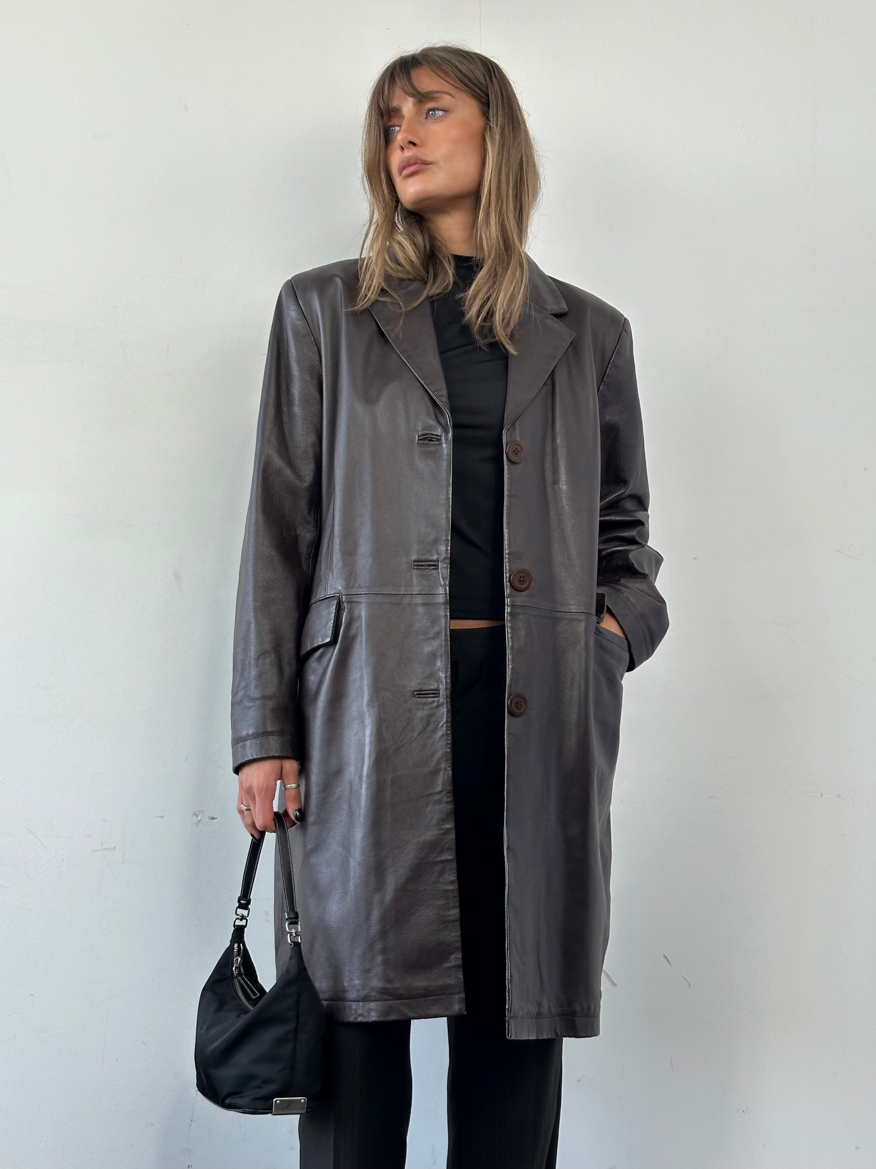 Vintage minimal leather trench coat jacket in size L, featuring a classic design with clean lines and timeless style.