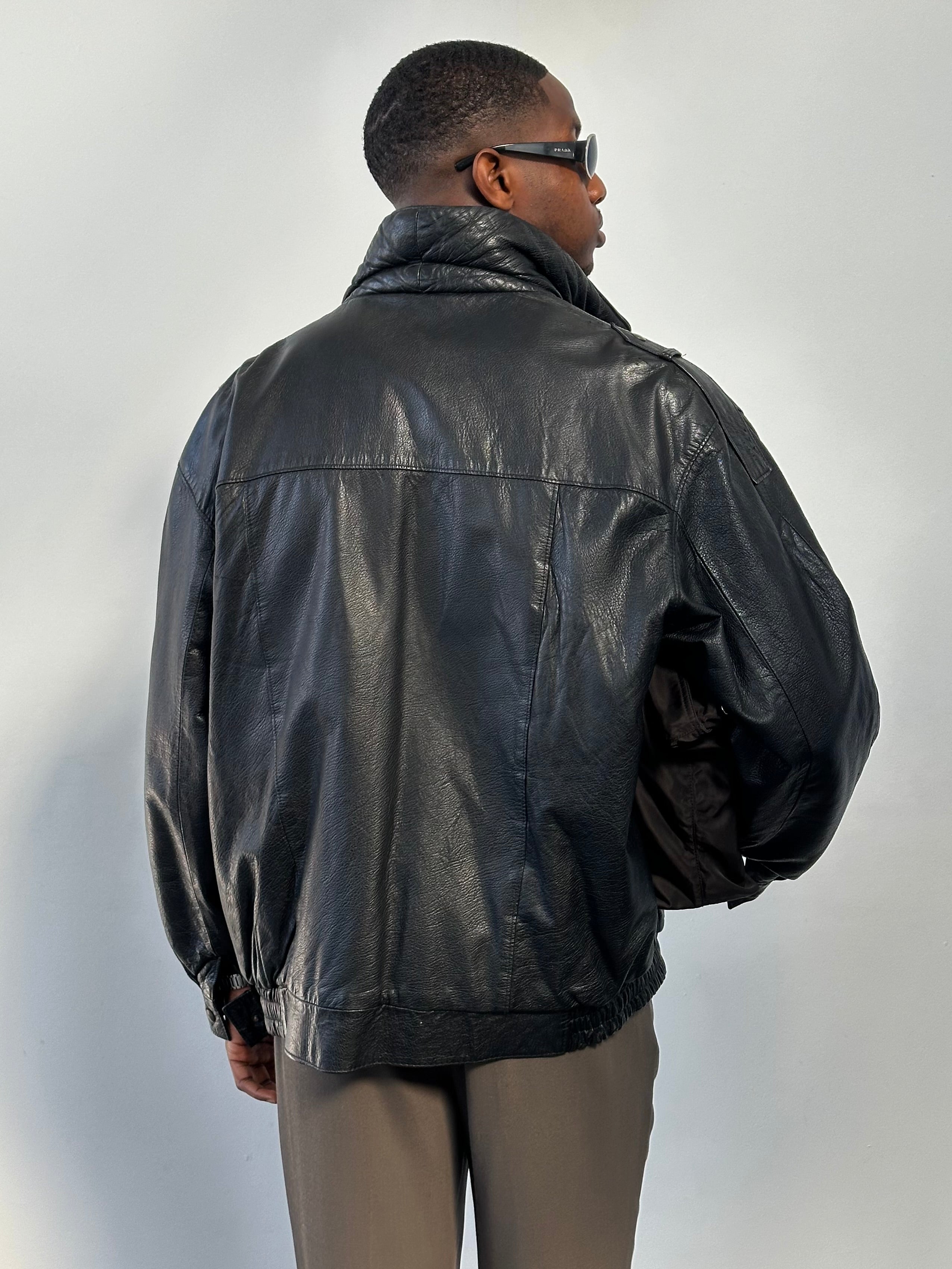 St Michael 1980s high neck leather bomber jacket in XL with front zipper and ribbed cuffs, black leather, vintage style.