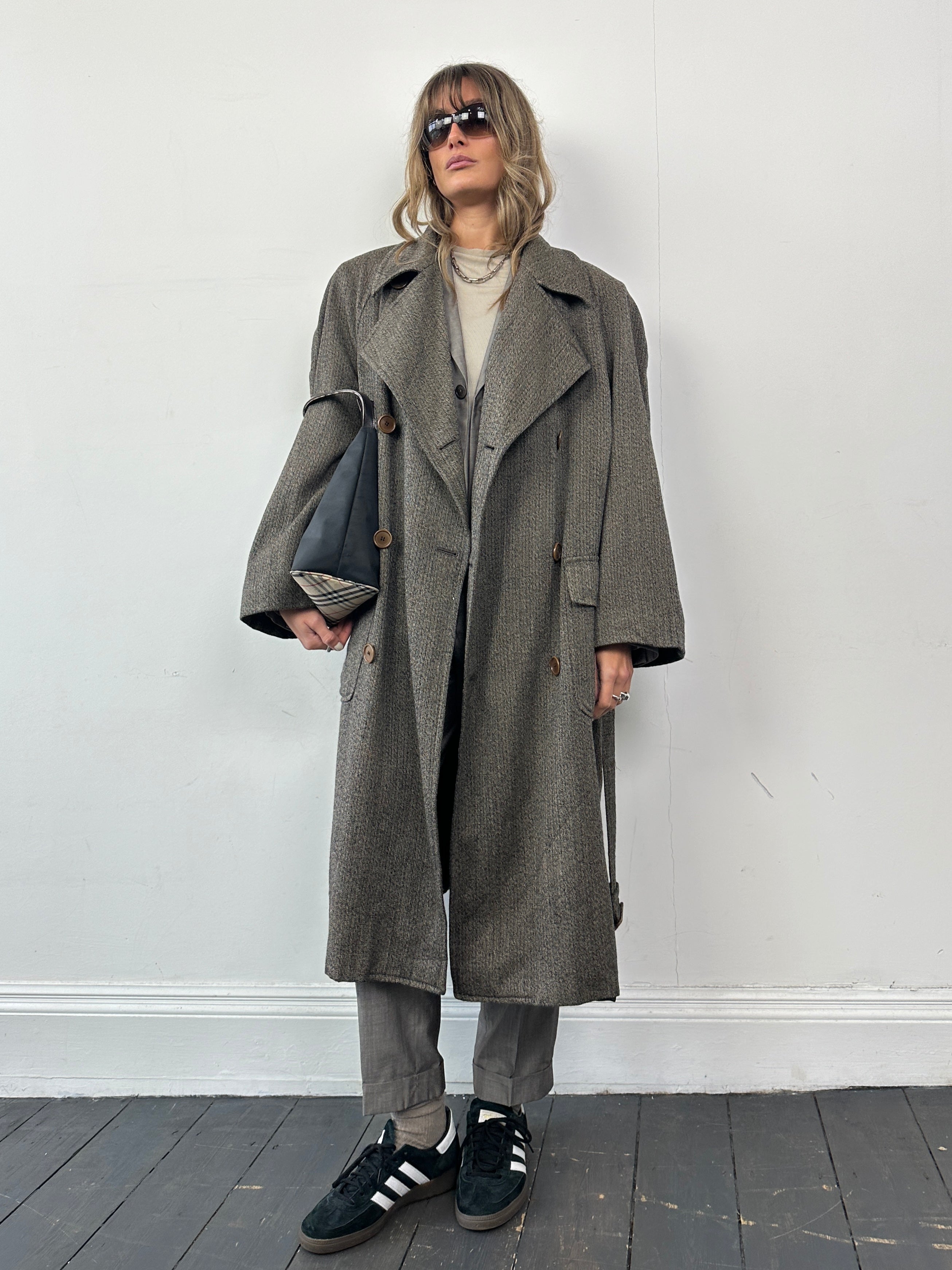 Gianfranco Ferre wool cashmere double-breasted belted trench coat in XL displayed hanging on a coat rack.