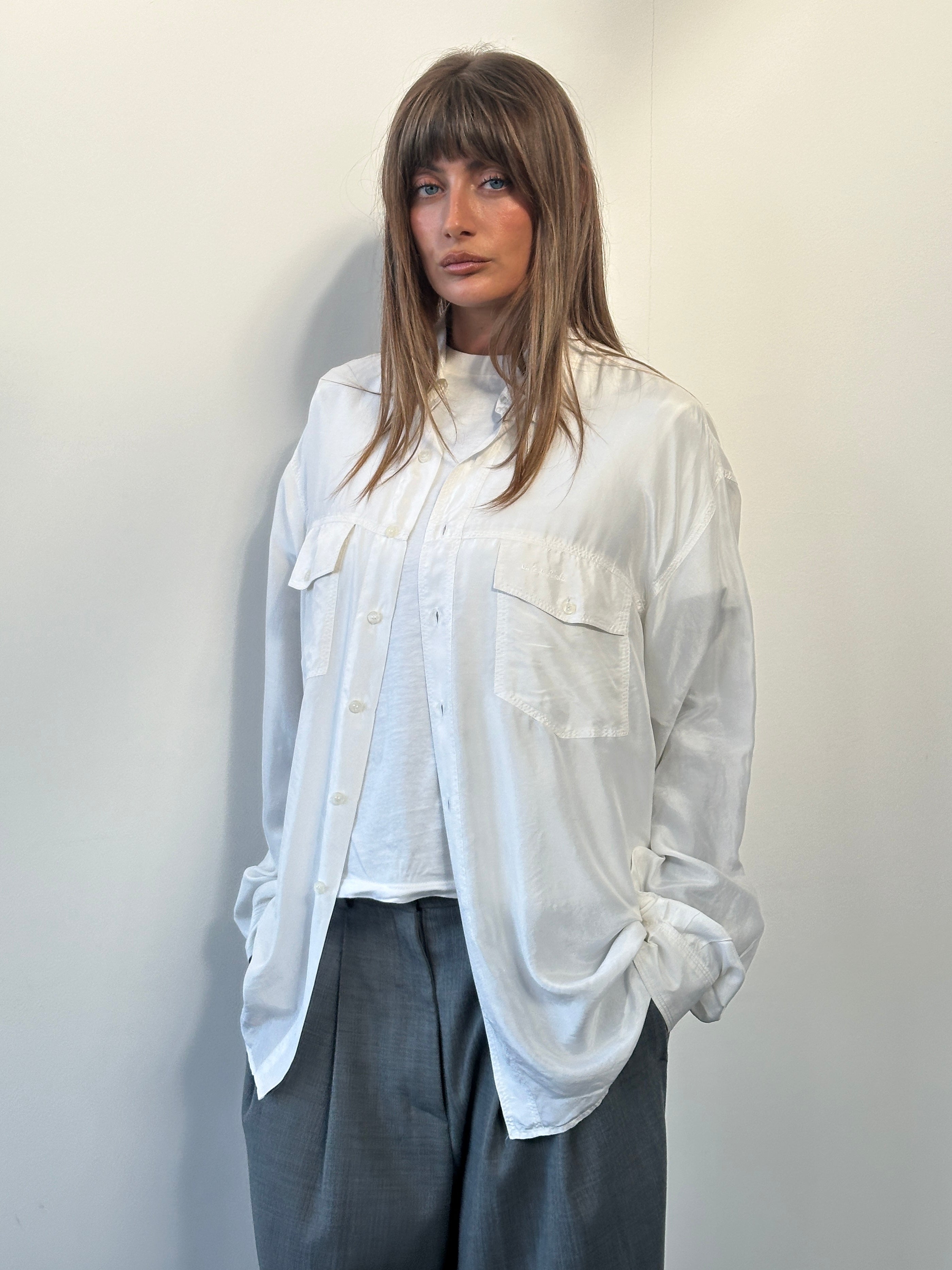 Vintage 1990s pure silk shirt in XL size, featuring classic design and smooth fabric, displayed on a hanger.
