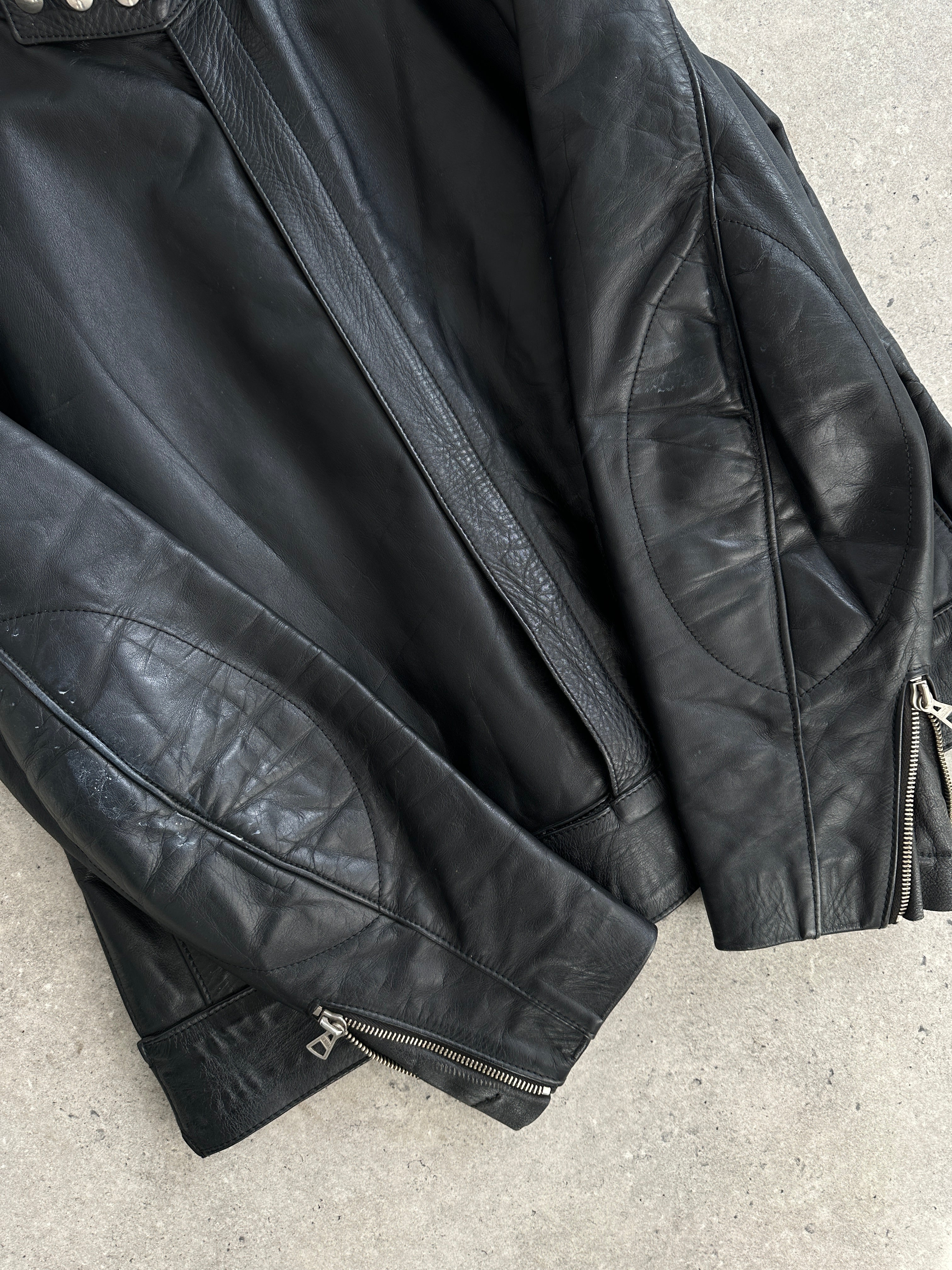 Vintage leather moto jacket in size large, featuring classic design with metal zipper and collar details.