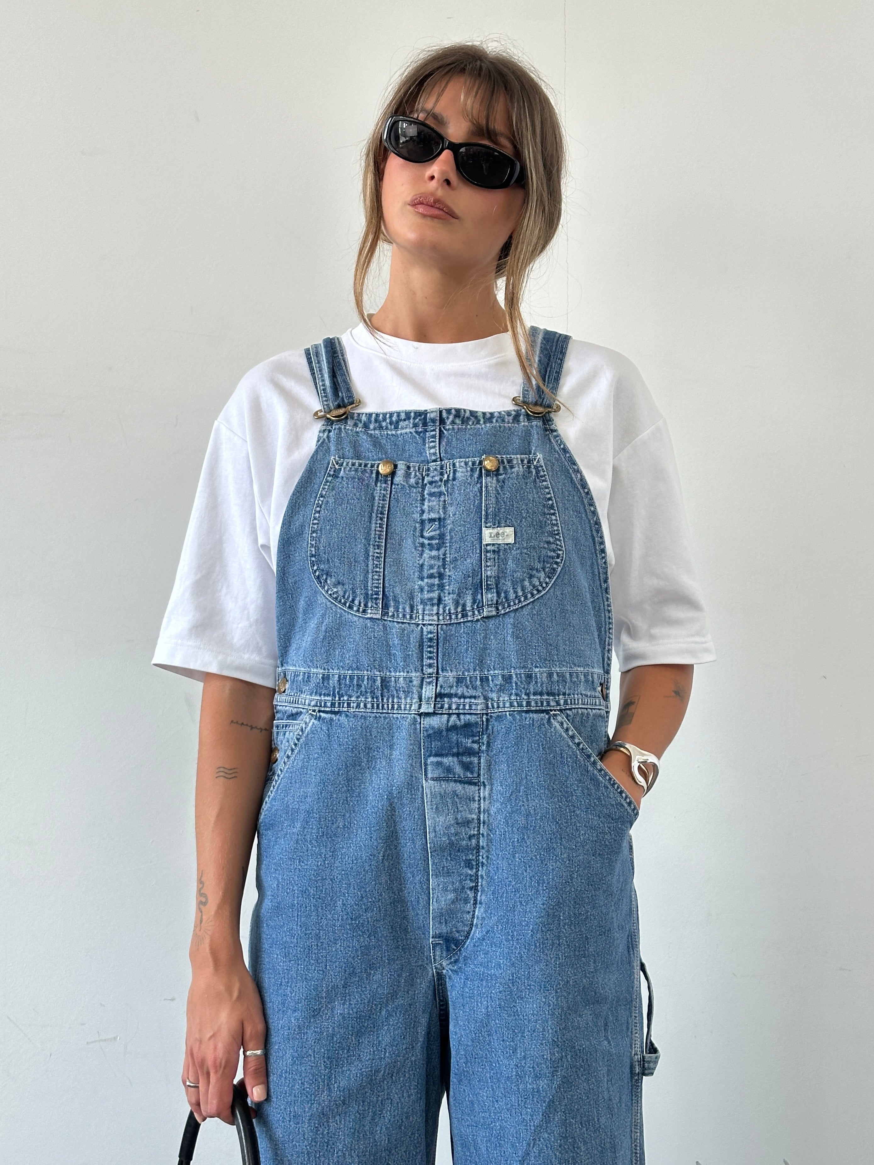 Lee Pure Cotton Denim Dungarees in size M, featuring classic blue denim fabric and adjustable shoulder straps.