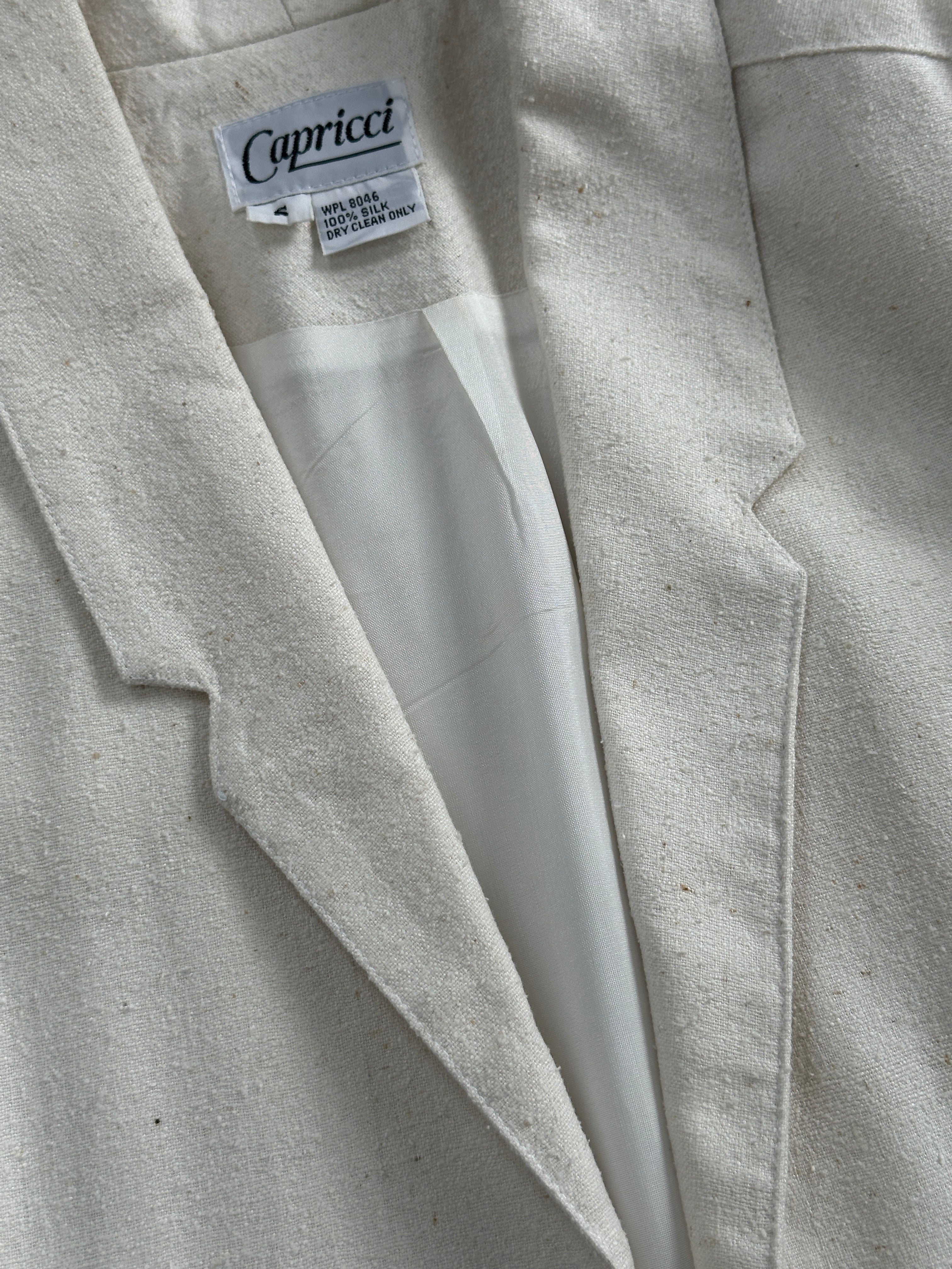 Vintage pure silk minimal blazer in size S/M, showcasing a sleek, tailored design with a classic collar and clean lines.