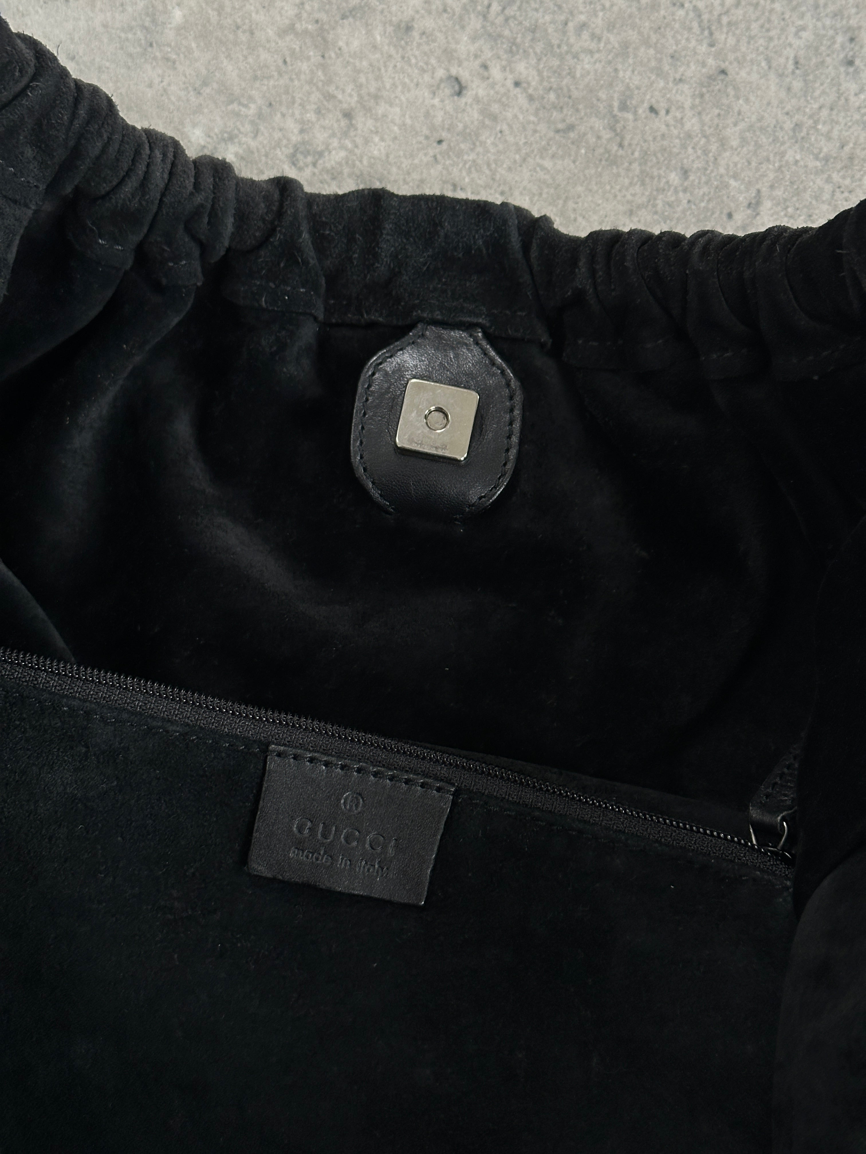Gucci 1990s Tom Ford suede leather hobo shoulder bag with rounded shape and top handle, featuring classic design details.