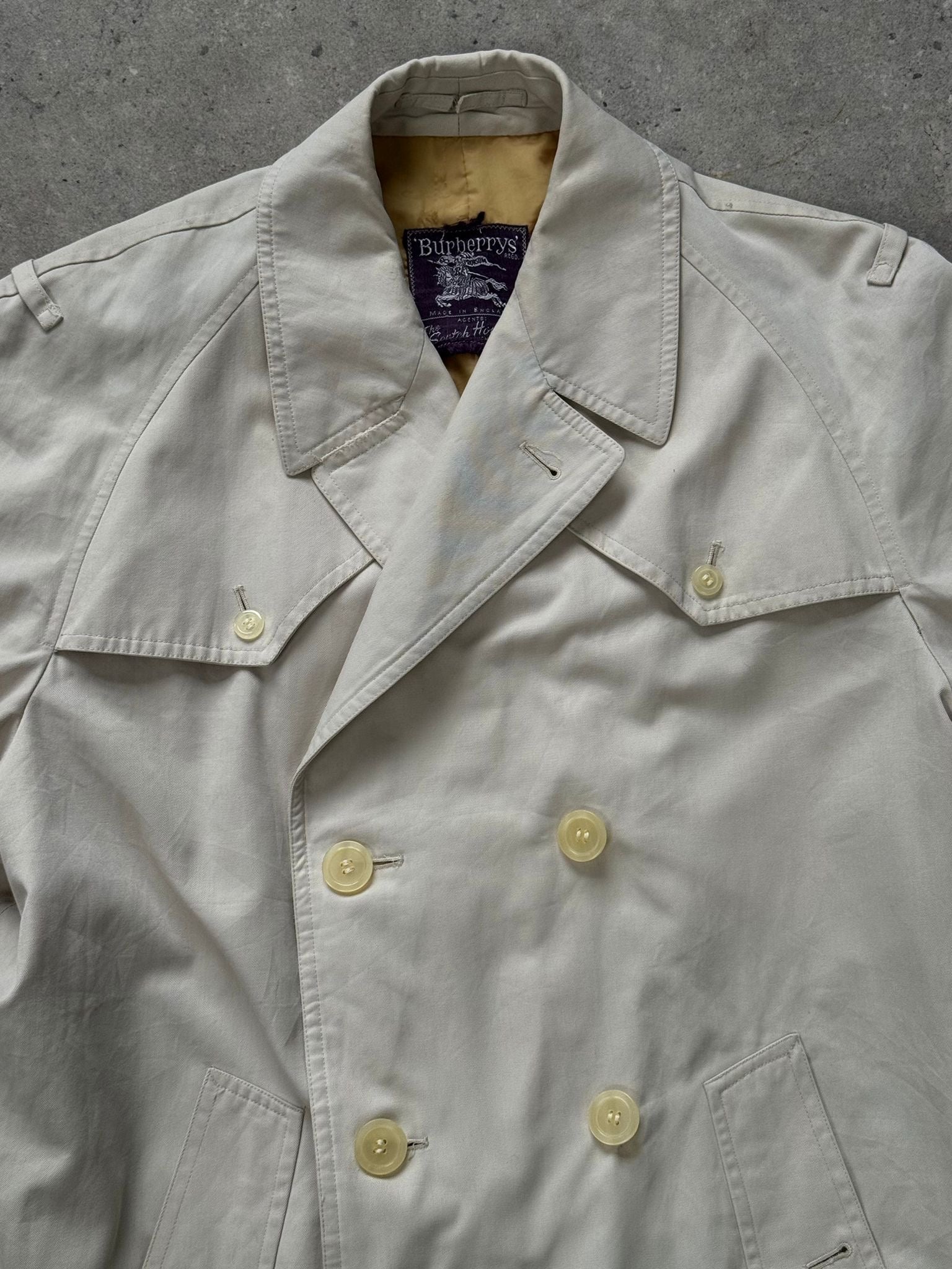 Burberry 1990s cotton double-breasted trench coat, M/L size, classic beige color, featuring belt and button details.