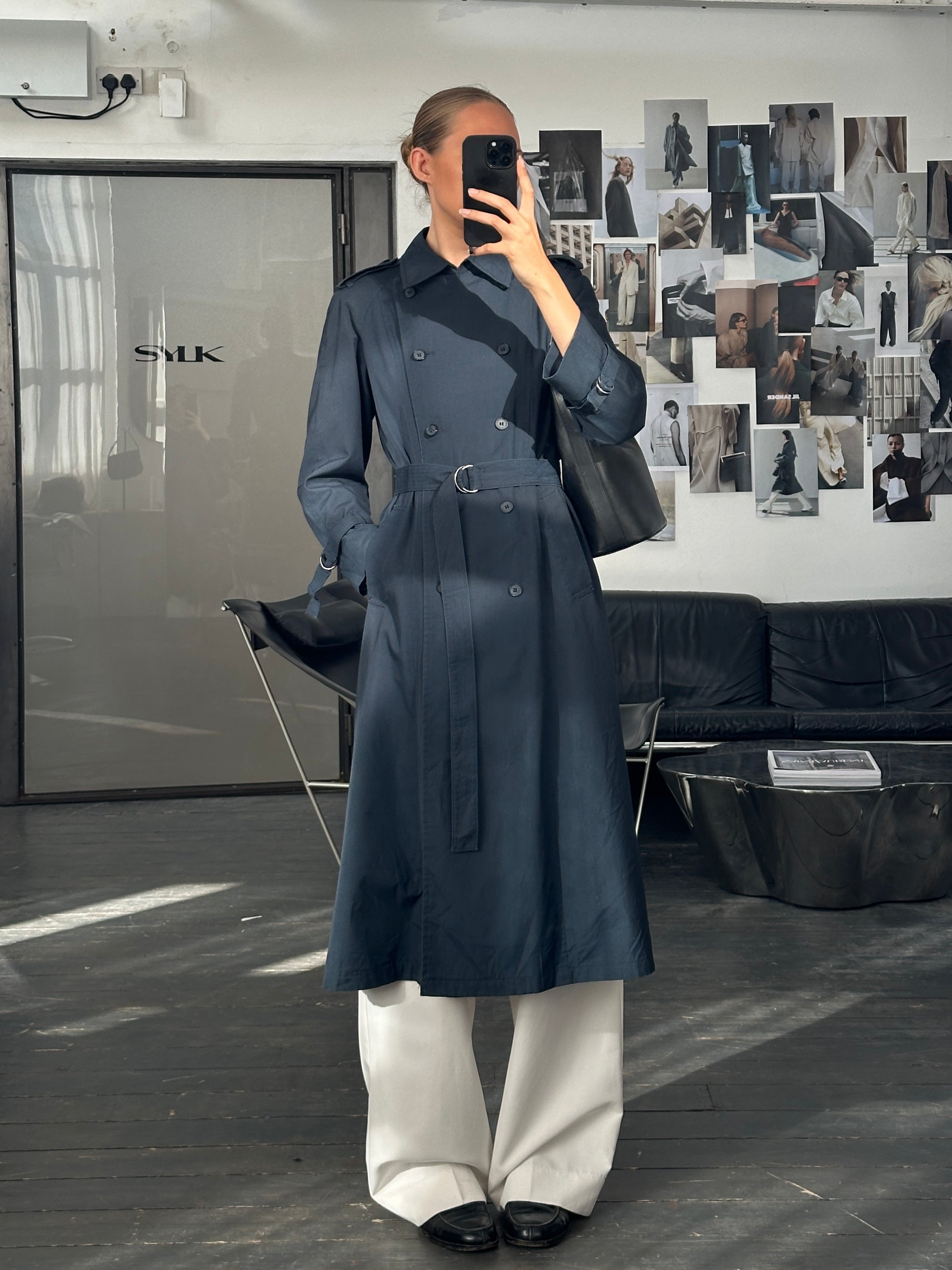 London Fog 1980s double-breasted cotton trench coat in size S, shown hanging with classic collar and belted waist.