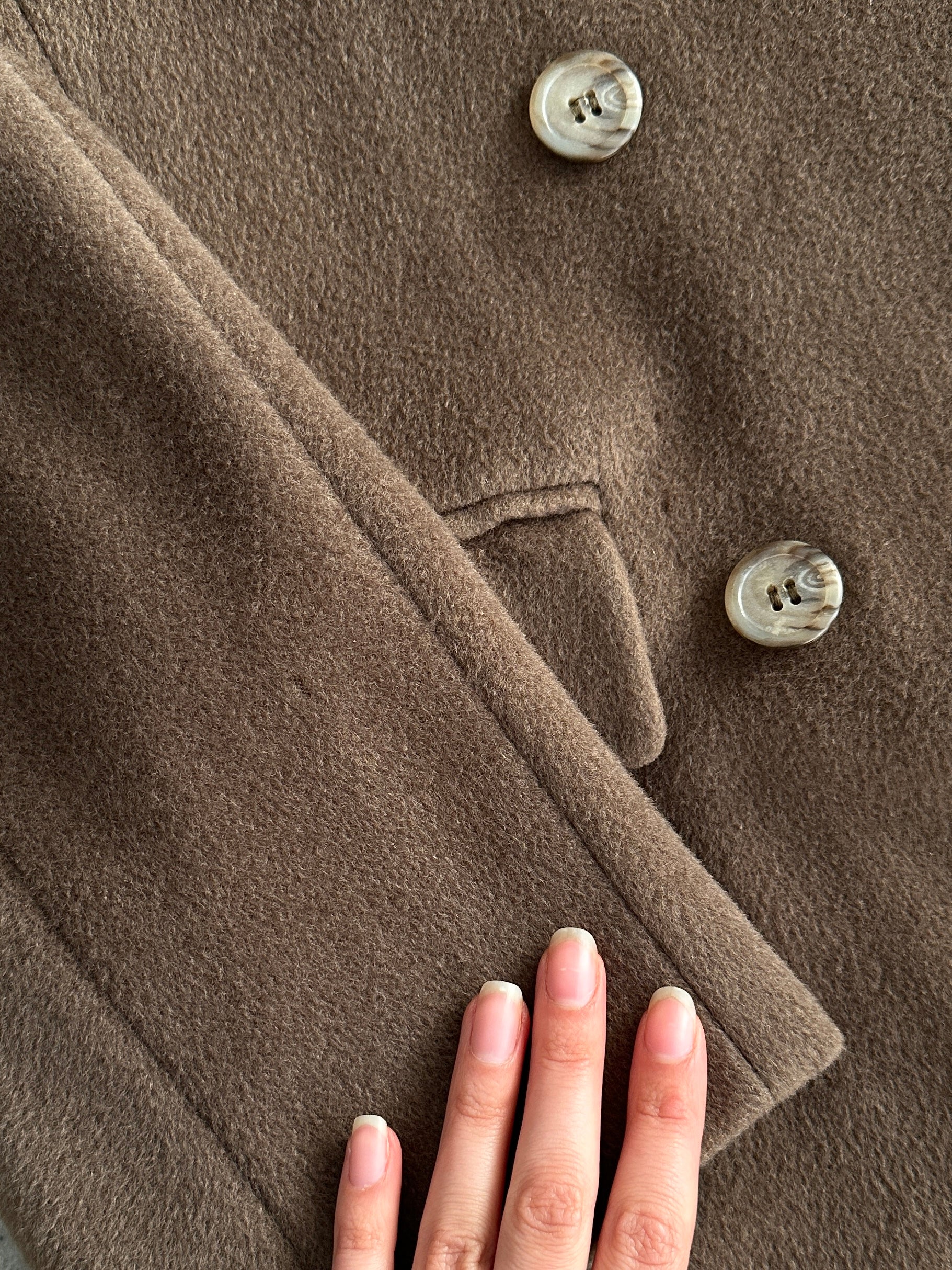 Max Mara pure wool double-breasted coat in size small, featuring classic lapels and tailored fit, shown on a neutral background.