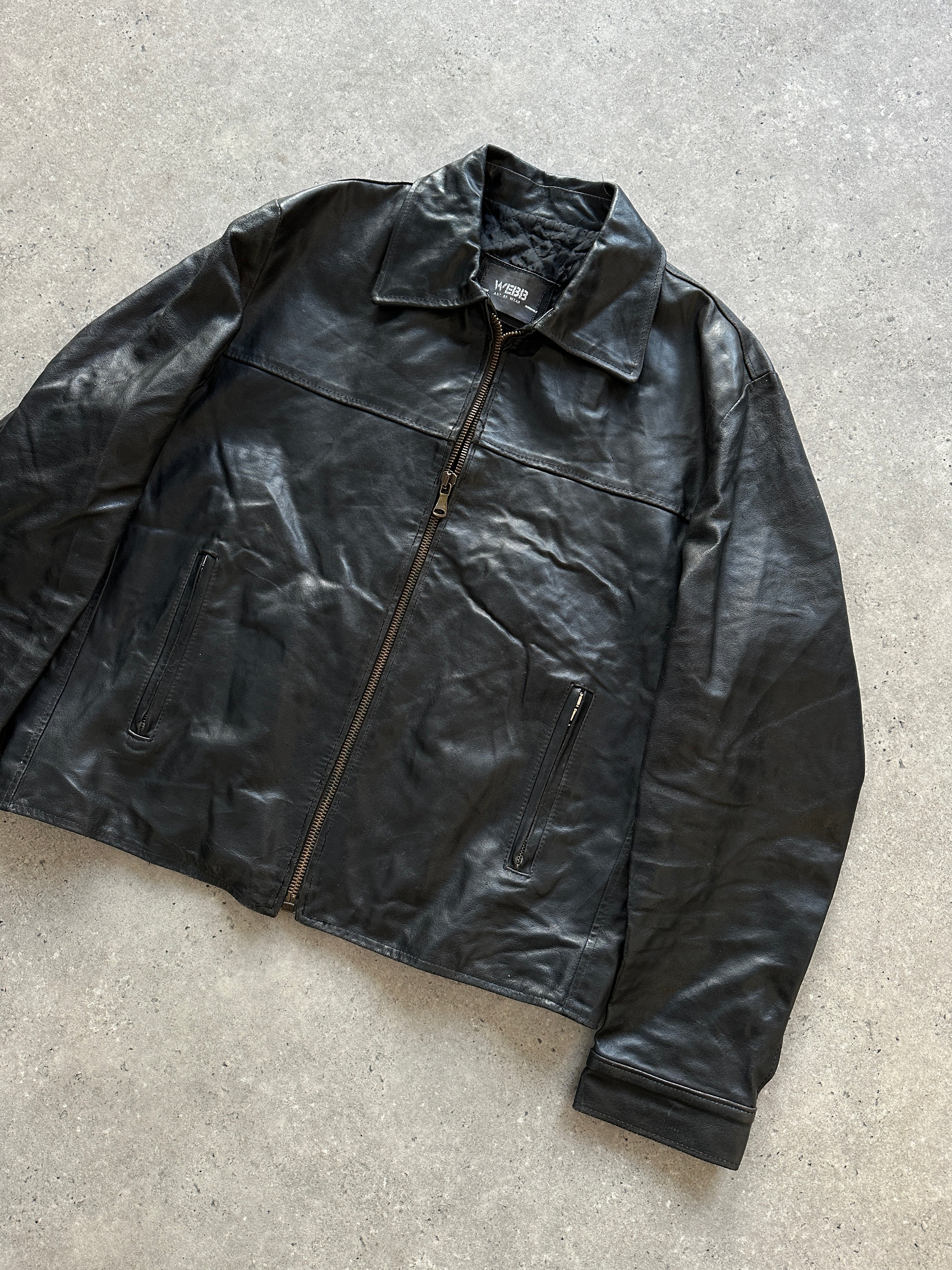 Vintage leather jacket in size L, showcasing classic design and rich texture, perfect for timeless style.