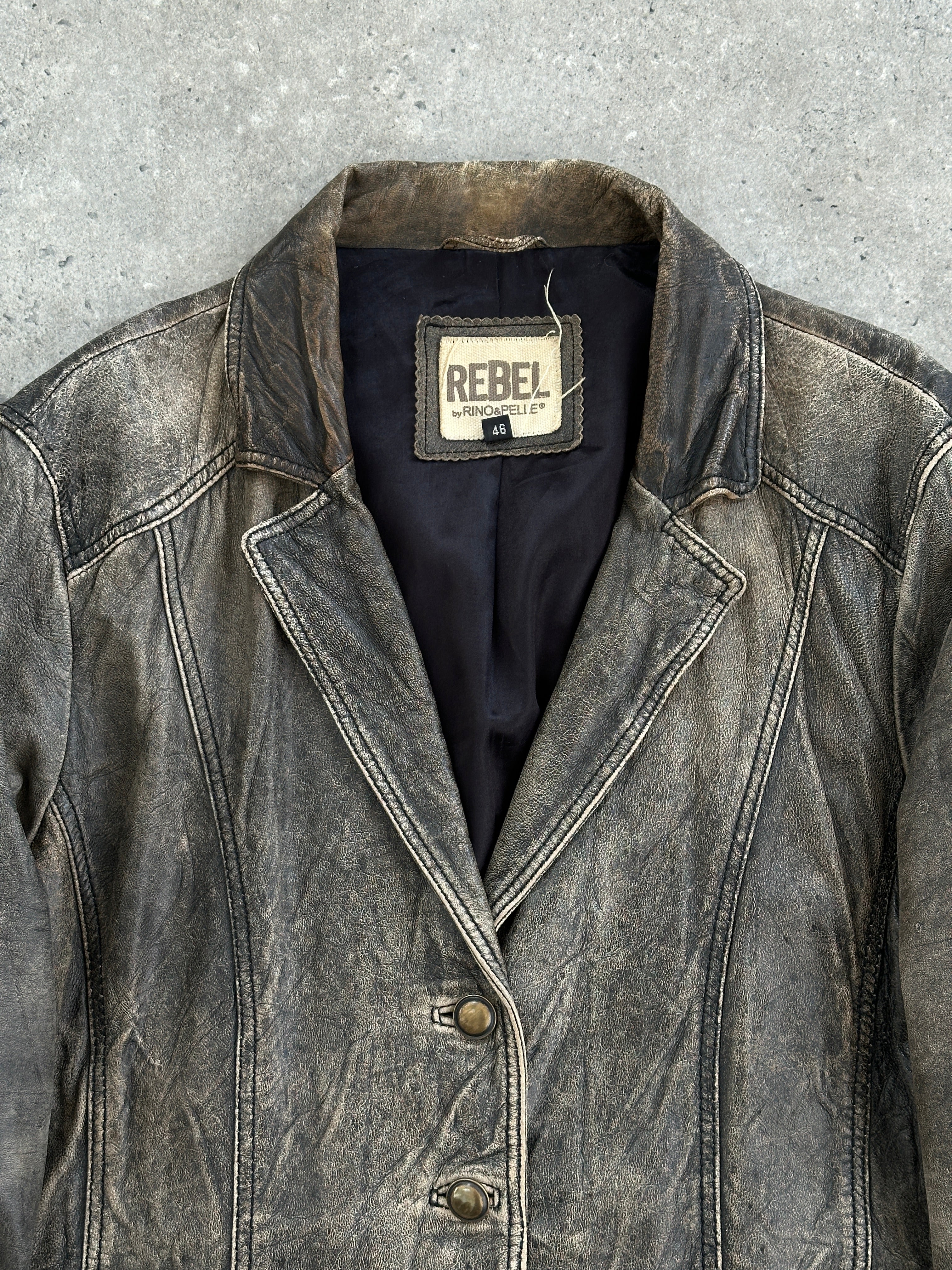 Vintage aged leather blazer jacket, size M, showcasing classic style and distressed leather texture.