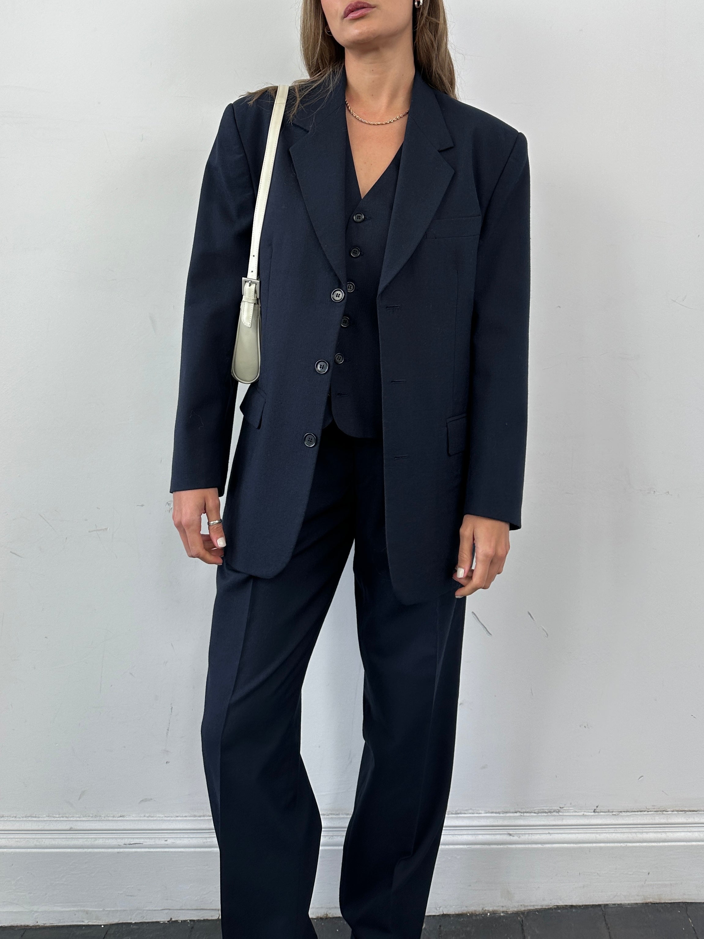 Vintage wool blend single-breasted three-piece suit, size 38R/W30, featuring classic tailoring and a timeless design.