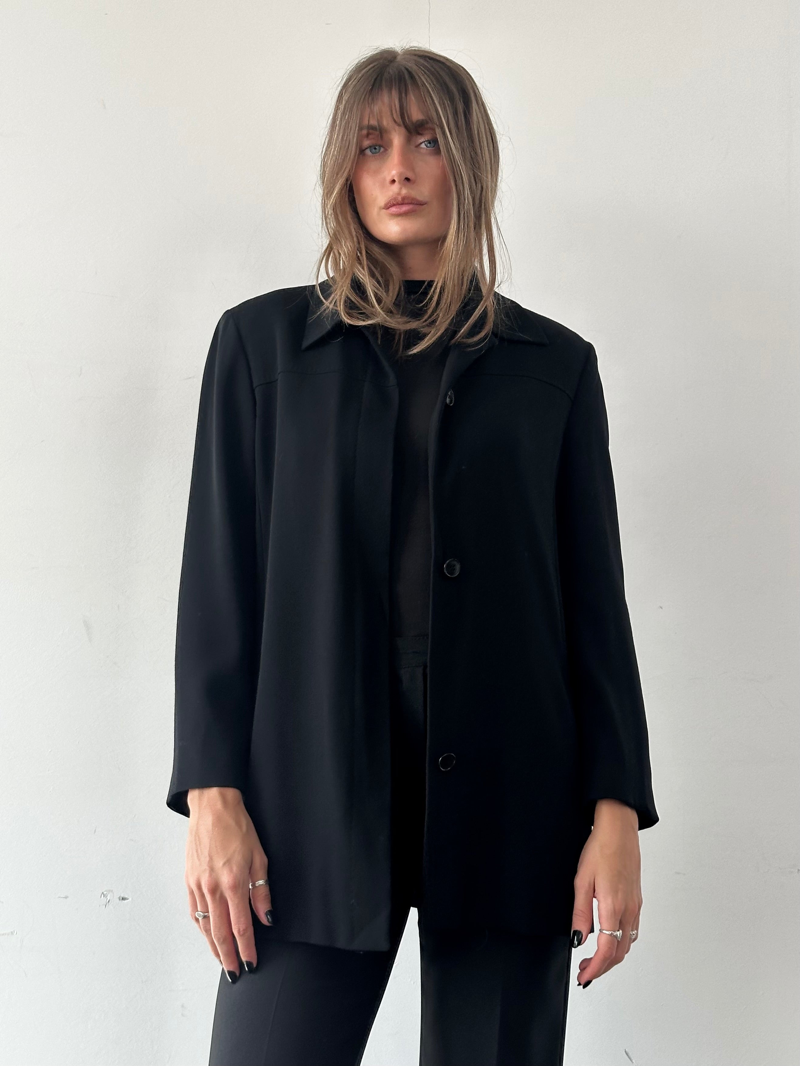 Max Mara minimal blazer with concealed placket, tailored fit, and classic design, shown in image with sleek lapel and structured silhouette.