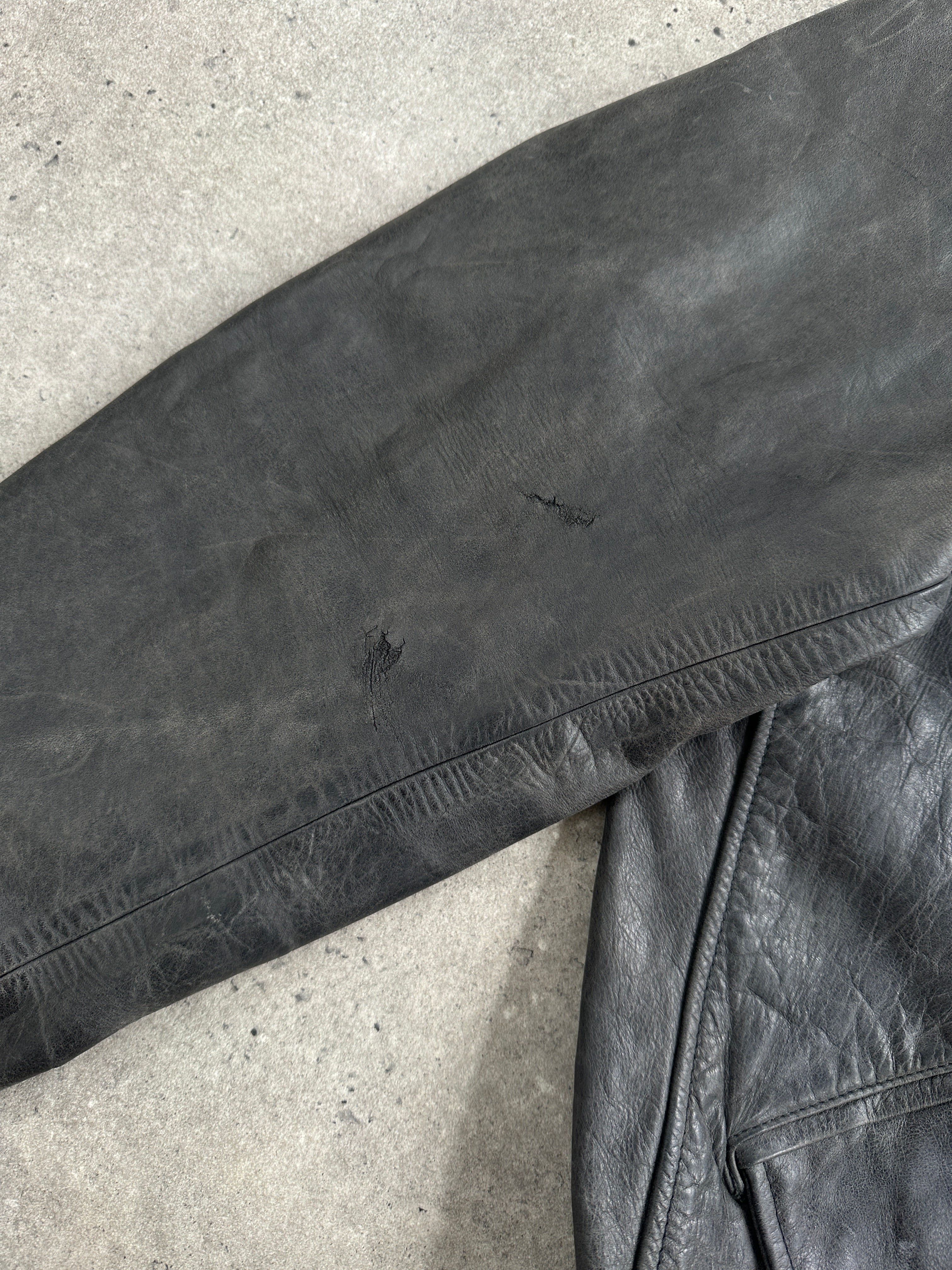 Vintage 1990s aged boxy leather jacket, large/X-large size, showcasing distressed brown leather and classic collar design.