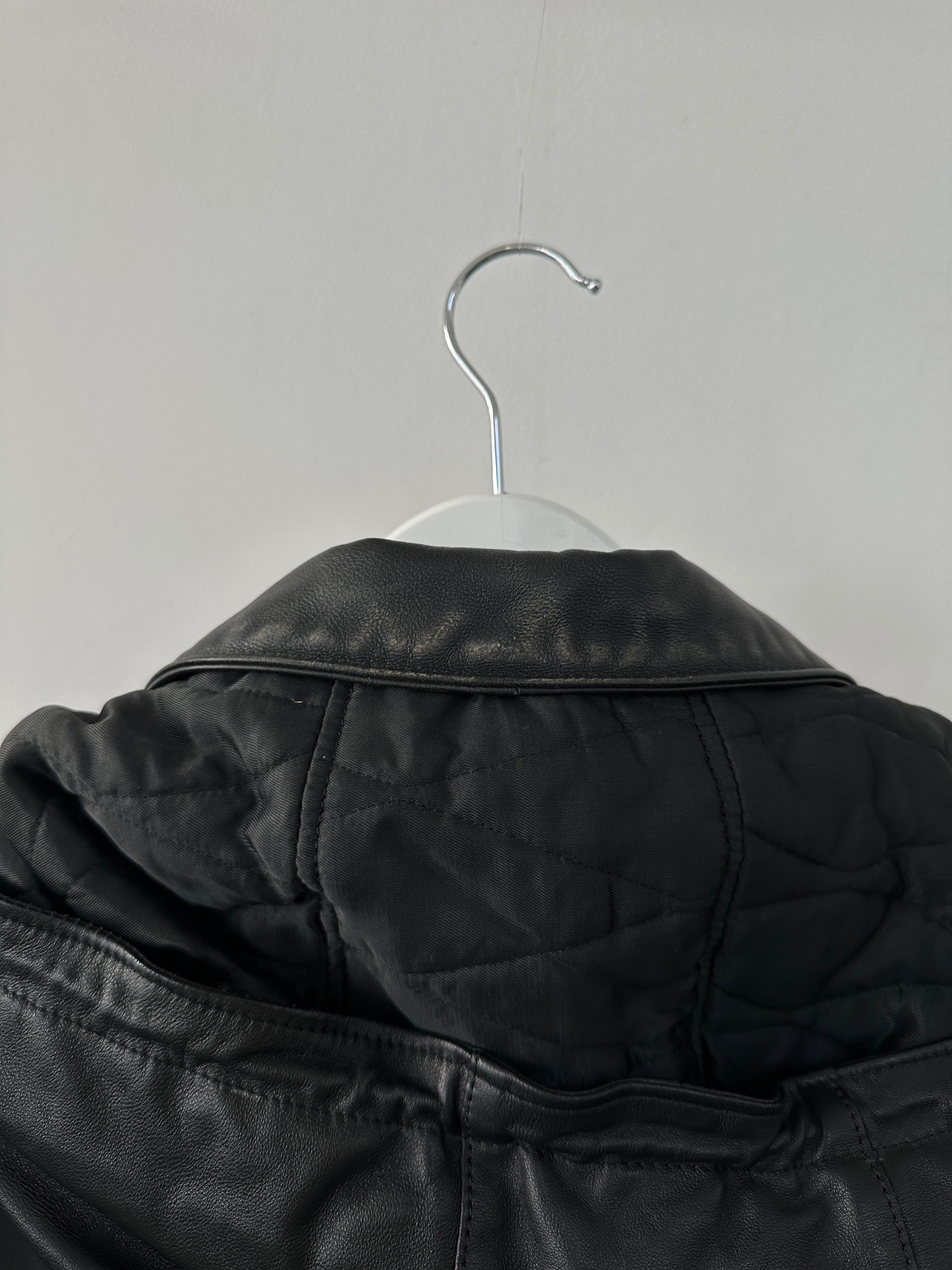 Vintage Italian vintage leather hooded trench coat in XL/XXL, featuring a classic design with a hood and detailed leather texture.