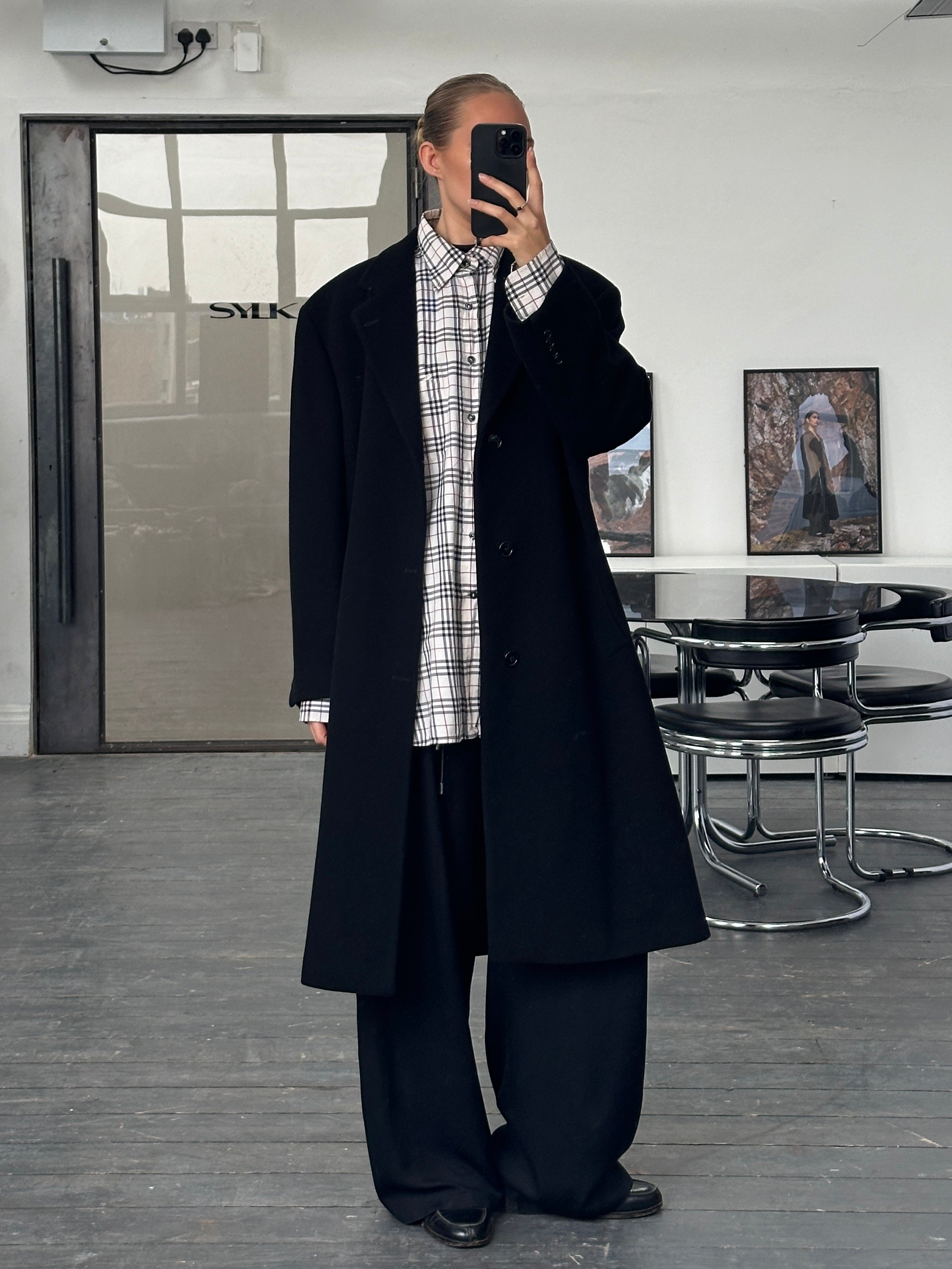 Vintage 1990s wool single-breasted coat in XL, featuring classic design and button details, displayed on a hanger.