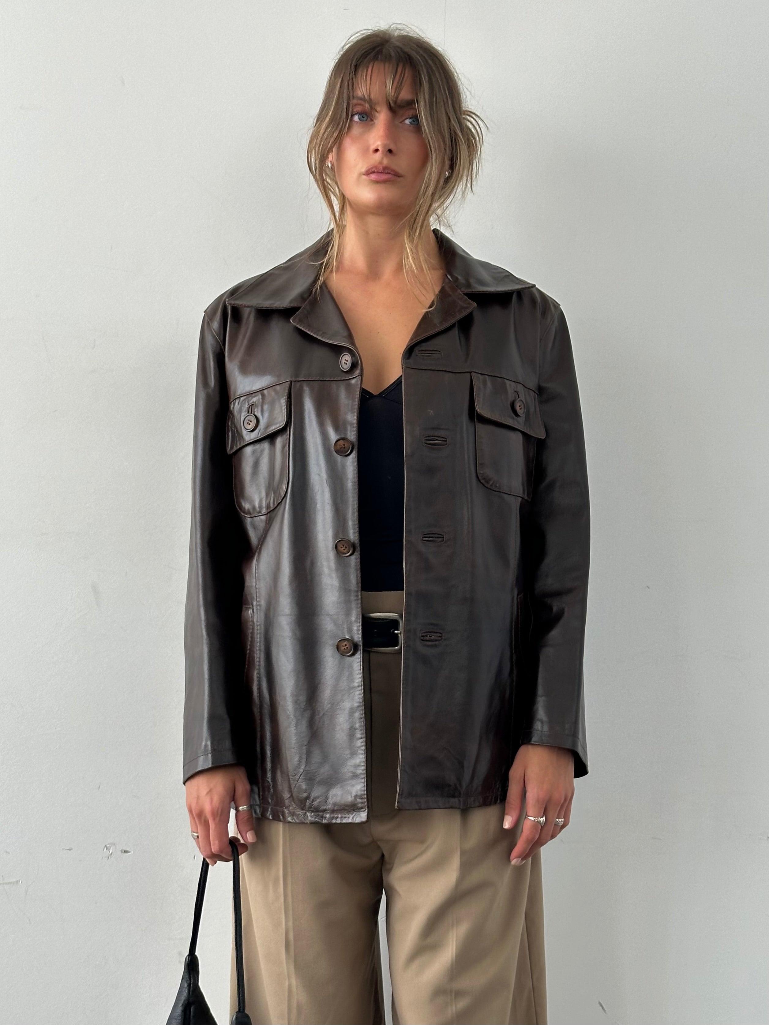 Conbipel boxy leather jacket in size L, featuring a stylish cropped fit and smooth black leather, shown on a model.
