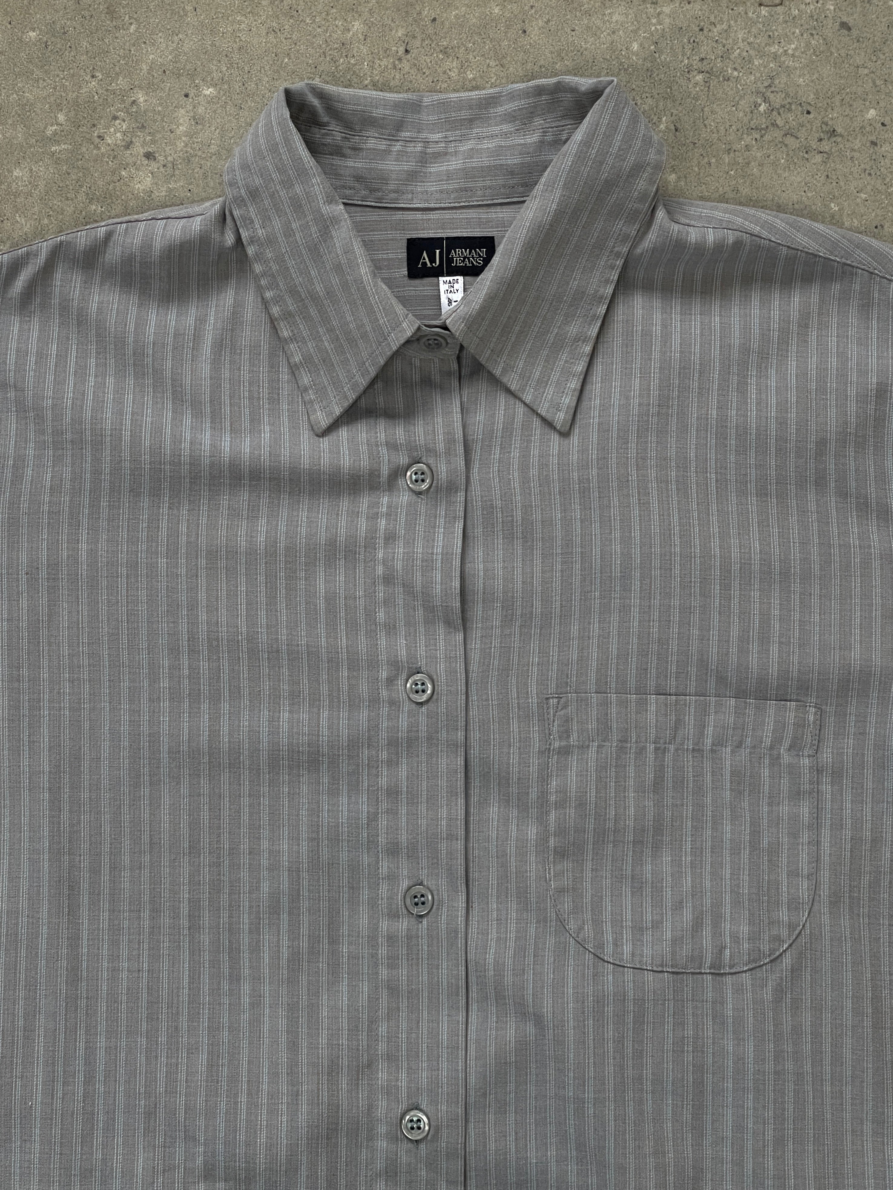 Armani Jeans 2000s stripe logo shirt in size M, featuring a classic design with bold stripes and the Armani logo on the chest.