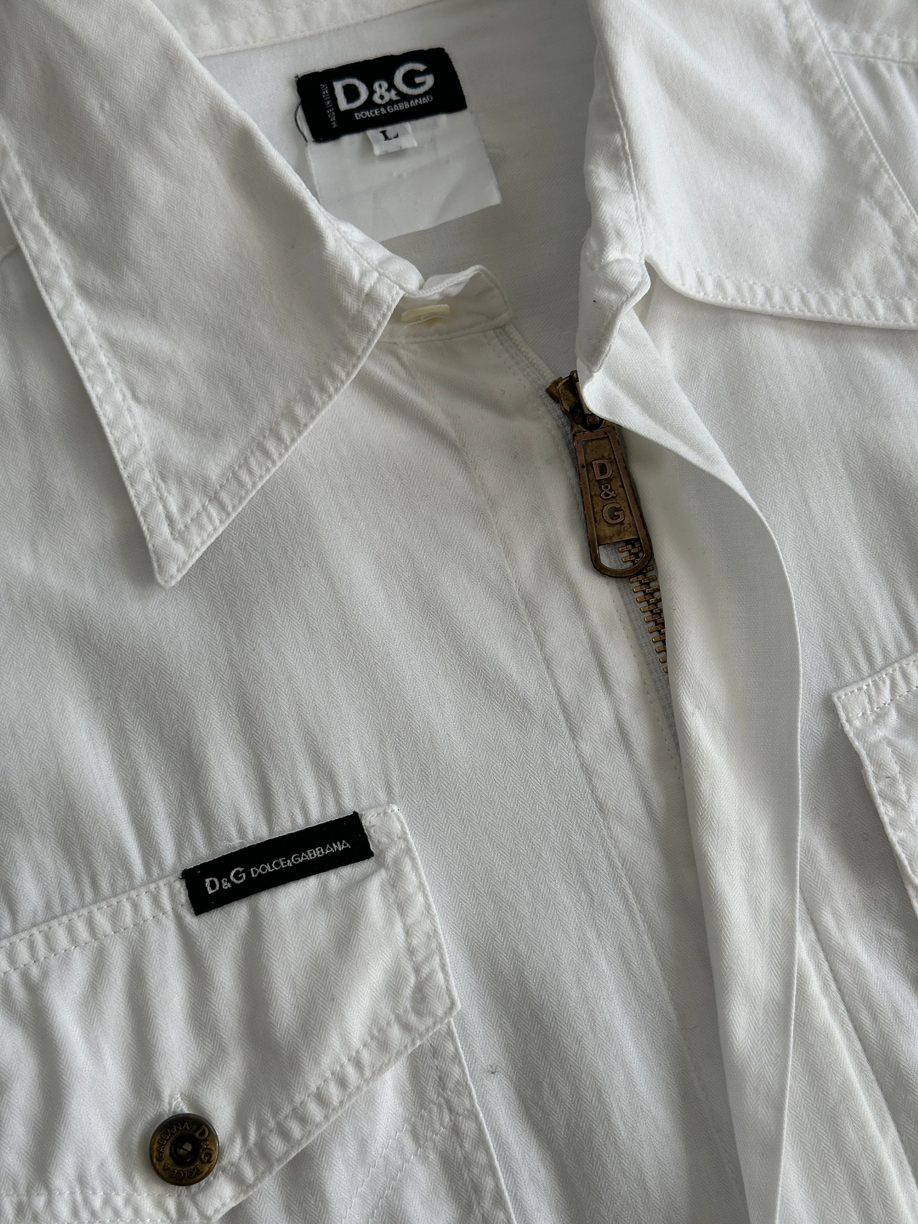 Dolce & Gabbana cotton shirt in size M/L displayed on a hanger, featuring classic design and high-quality fabric.