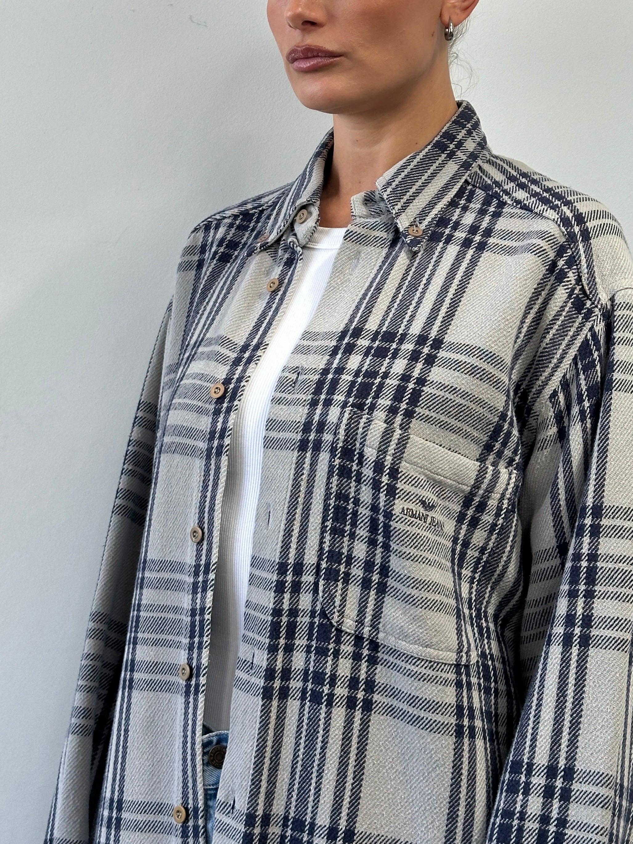 Armani Jeans check flannel cotton shirt in size L/XL with logo detail, featuring a classic plaid pattern and button-front design.