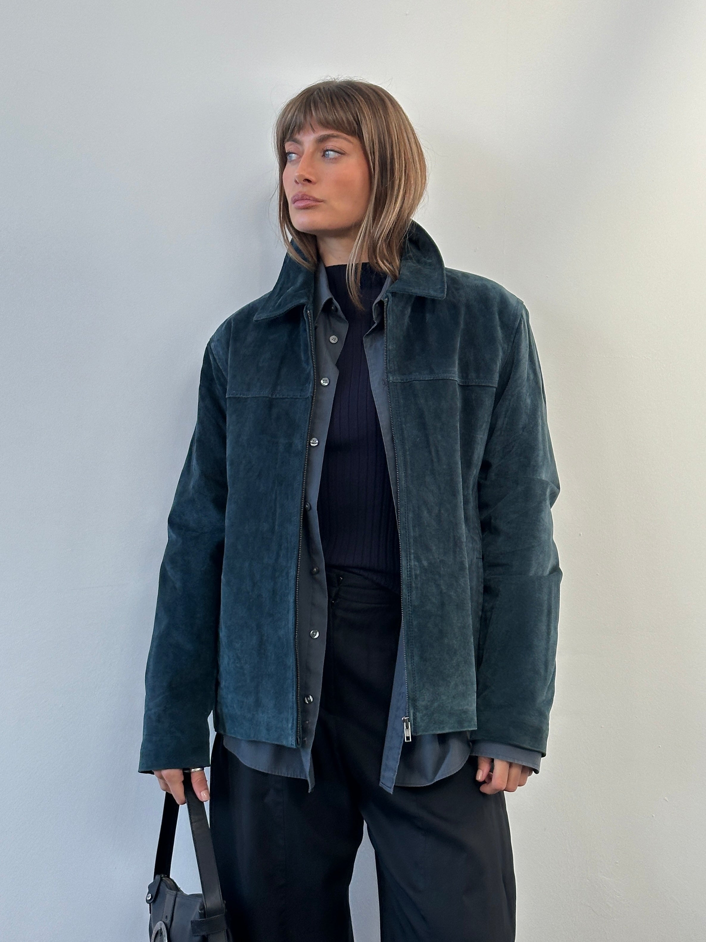 Balmain Paris 1990s suede zip leather jacket, size large, shown in a stylish shot highlighting the jacket's sleek design and rich texture.