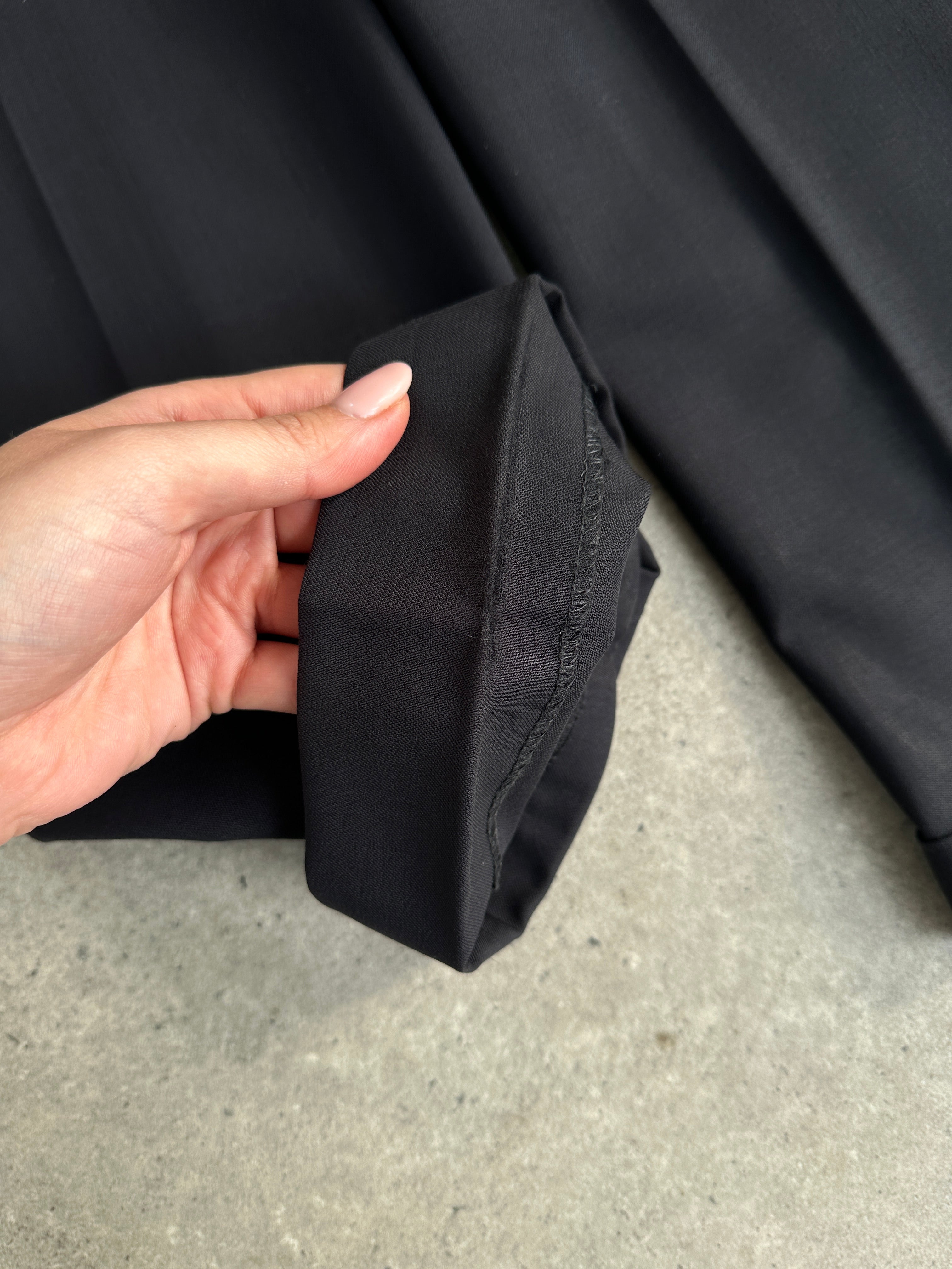 Yves Saint Laurent Pour Homme wool single-breasted suit in size 38R/W30, displayed on a hanger, tailored fit, classic style.