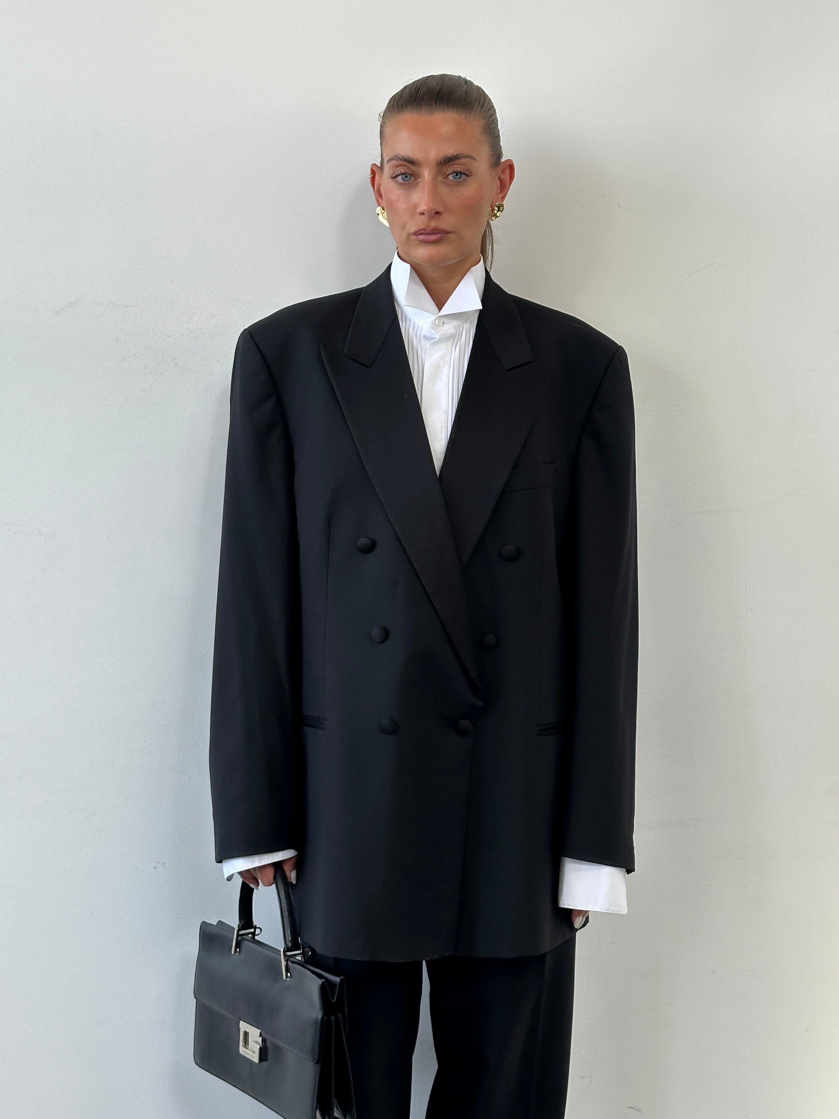 Vintage 1990s men's double-breasted tuxedo suit made of pure wool, size 46R/W34-36, featuring classic tailored style.