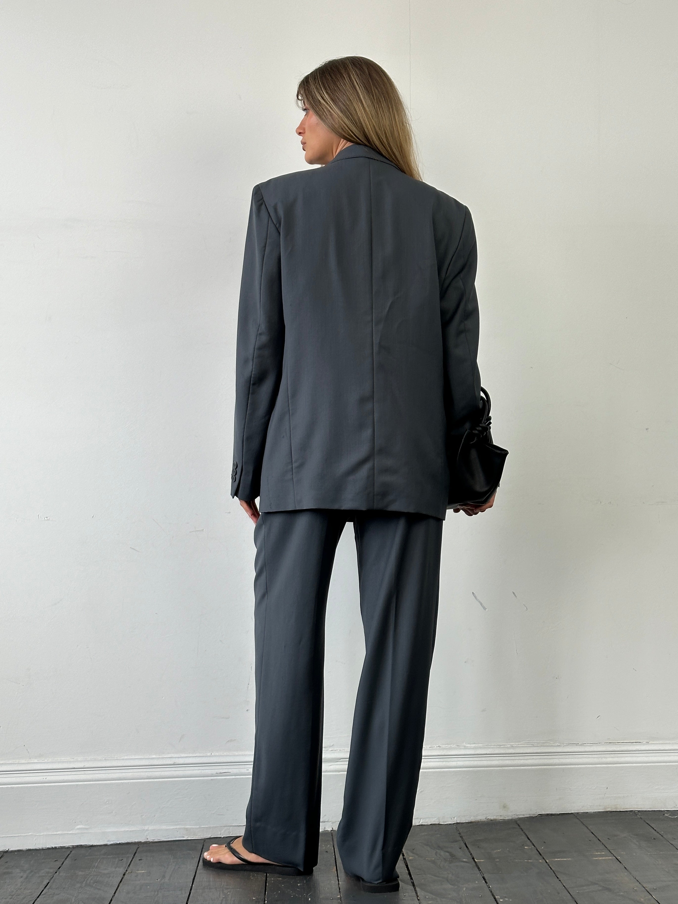 Vintage Italian double-breasted wool blazer in size 40R/W28, classic vintage suit jacket with tailored fit and timeless style.