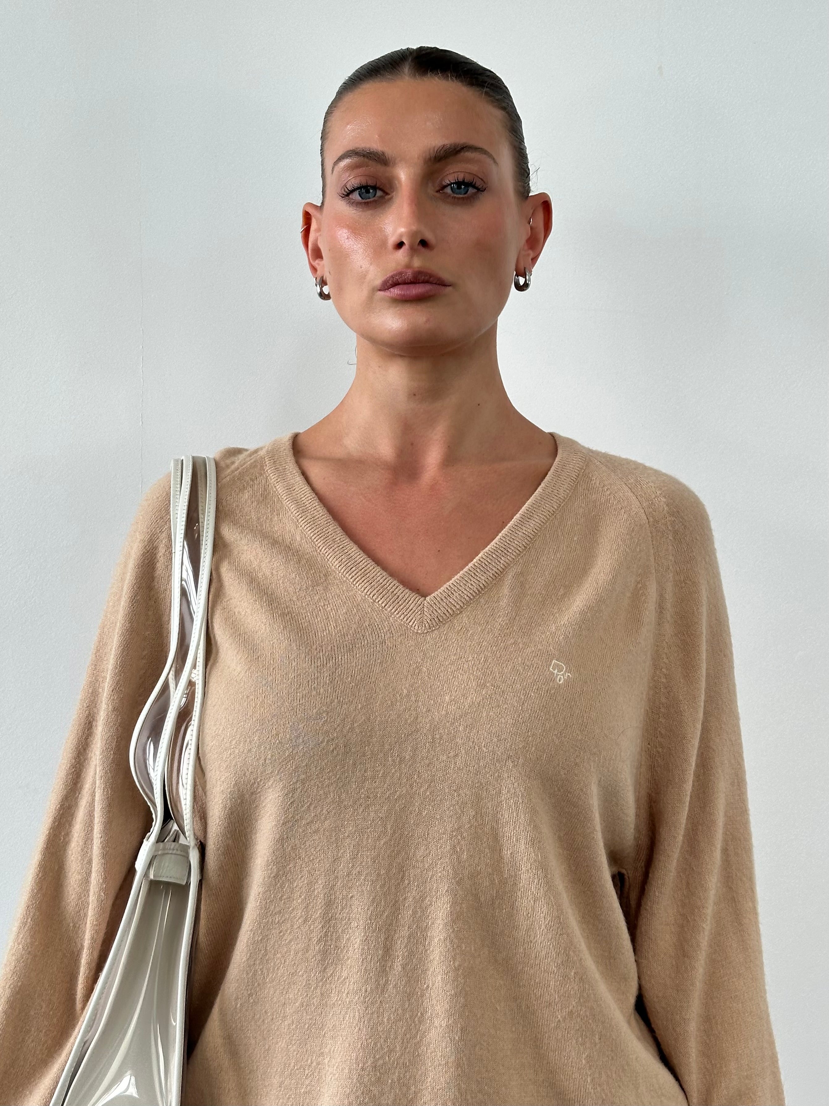 Christian Dior 1980s V-neck logo knitted jumper in size L, featuring classic Dior branding and a cozy knit fabric.