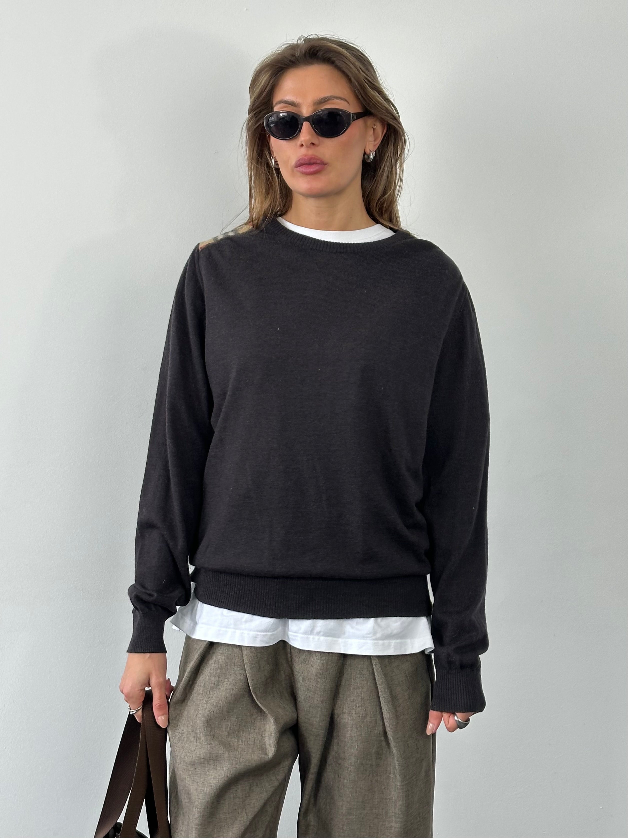 Burberry London 2000s wool knit jumper in size M, featuring classic pattern and cozy wool texture.