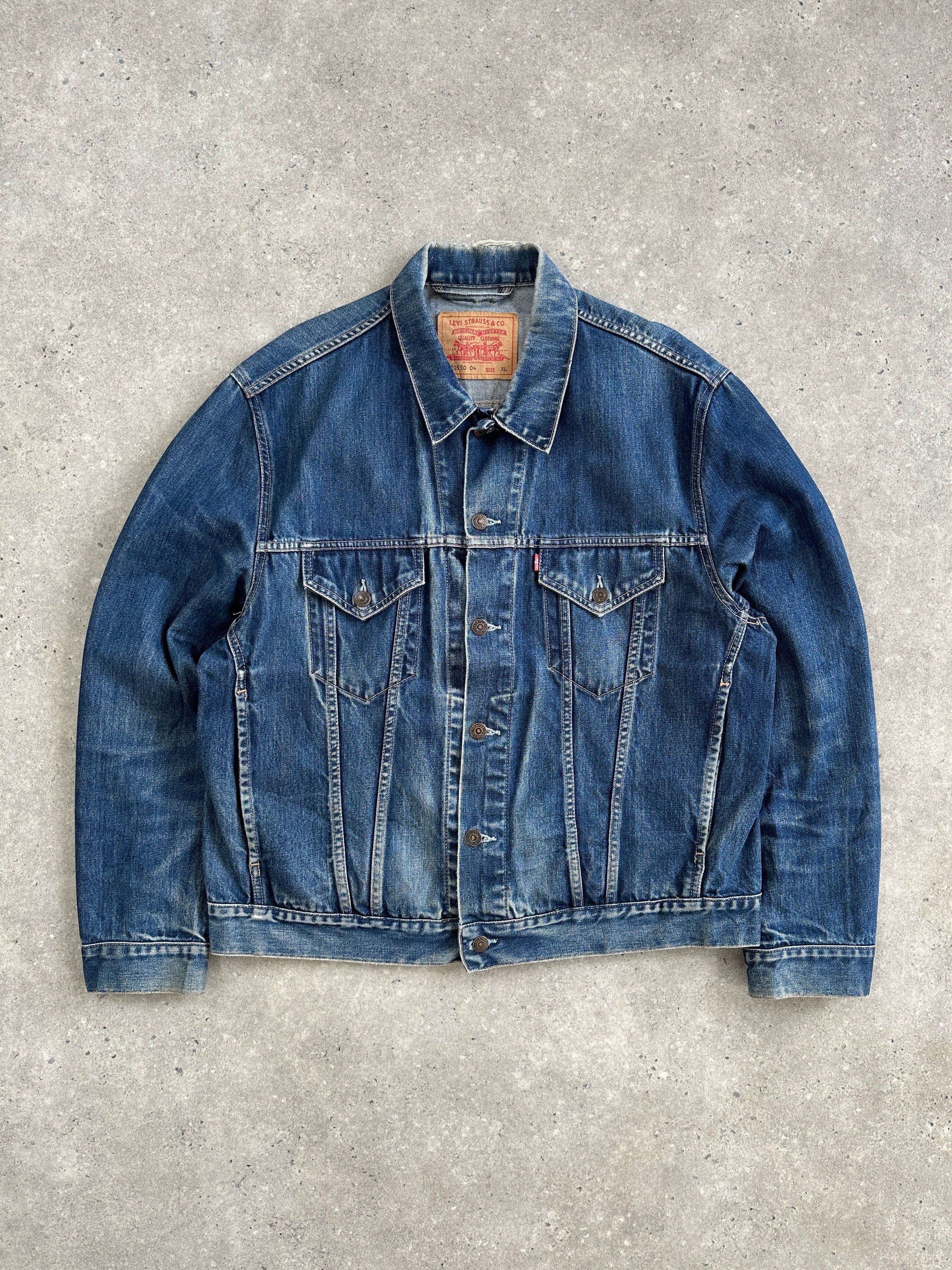 Levi’s 1990s mid wash denim jacket in XL size, featuring classic styling and visible button details.