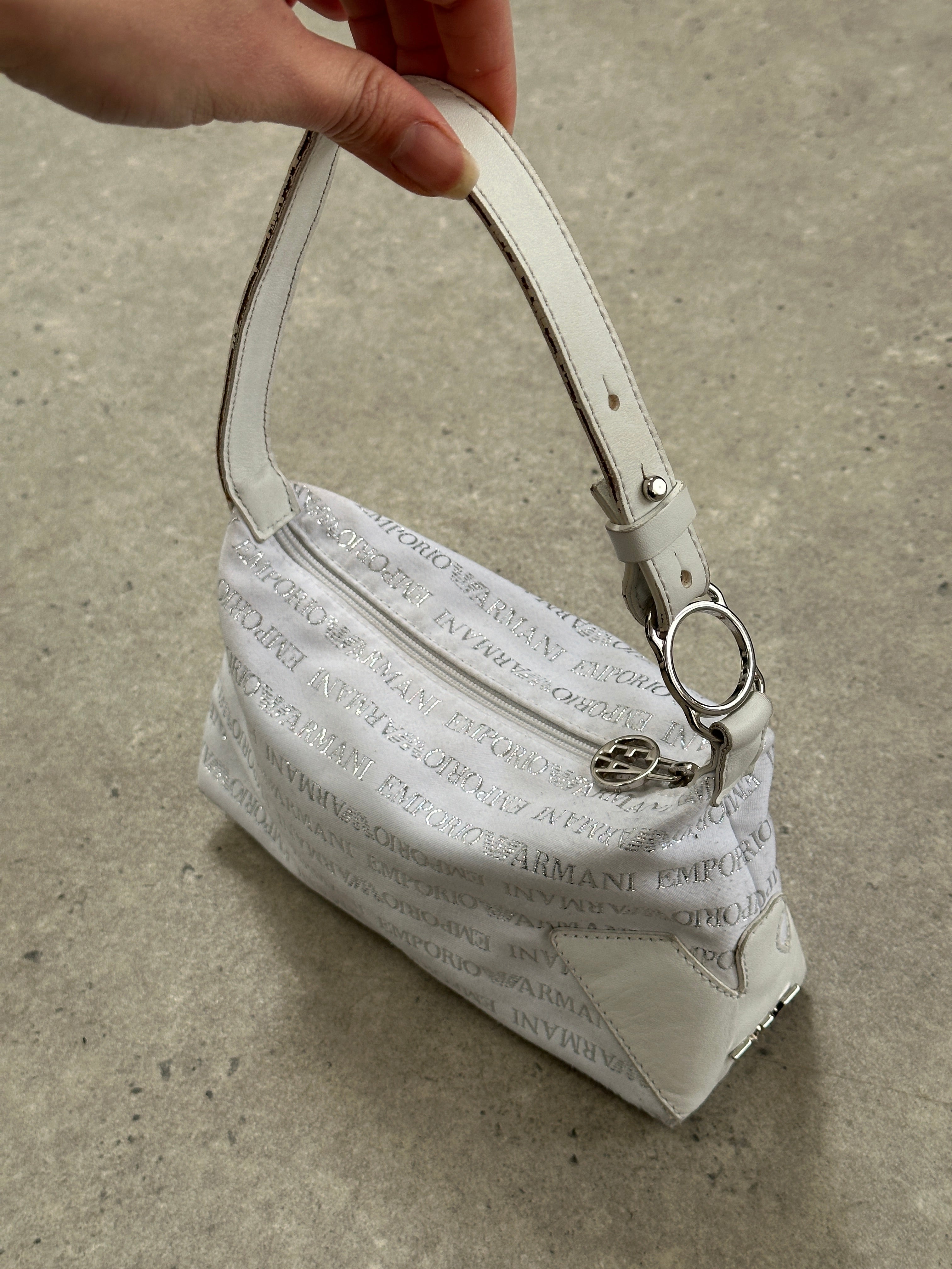 Emporio Armani Monogram shoulder bag featuring a sleek design and signature logo pattern on high-quality material.