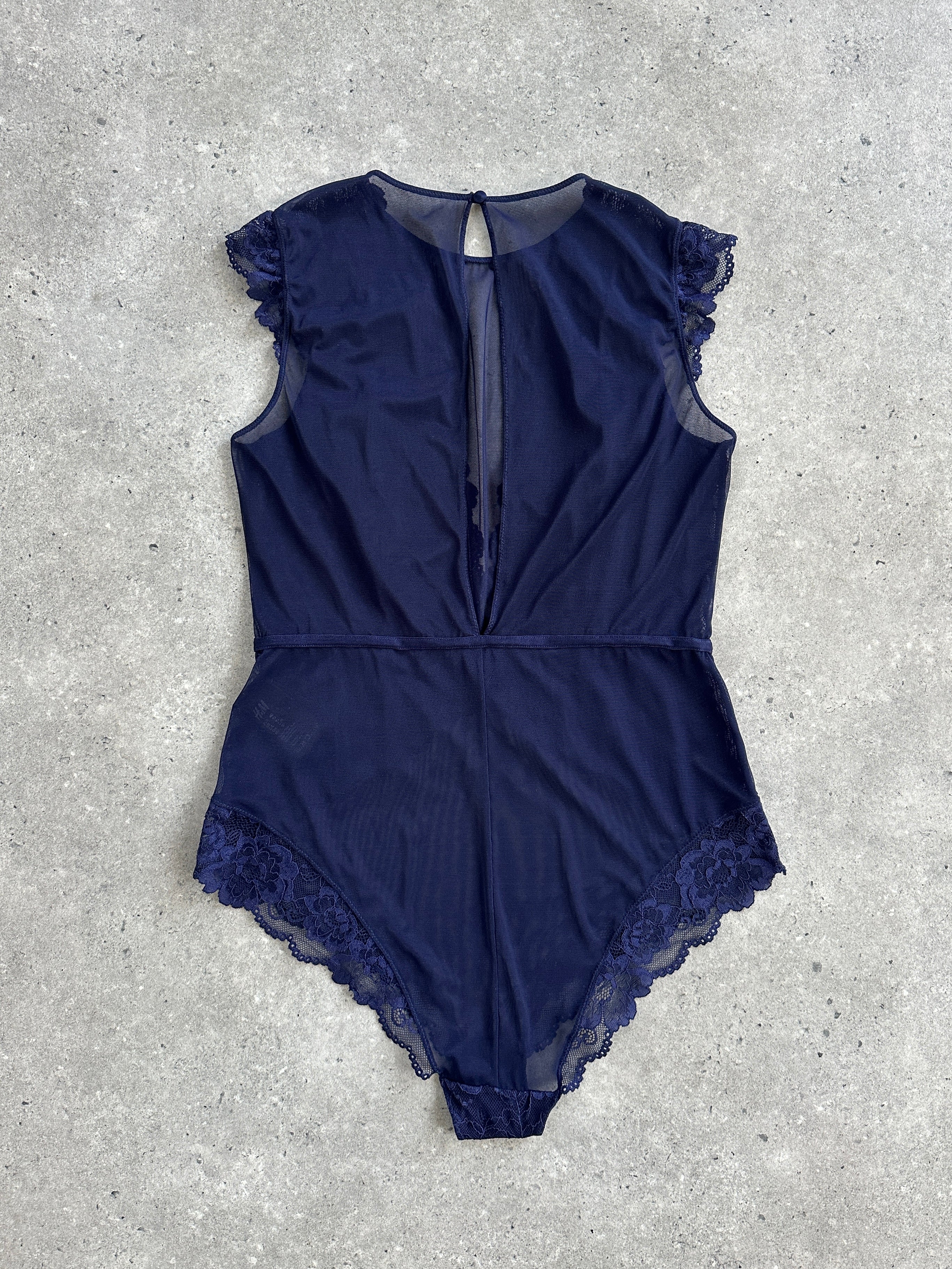 Vintage 2000s lace bodysuit top in medium size, featuring delicate lace details and a fitted silhouette.