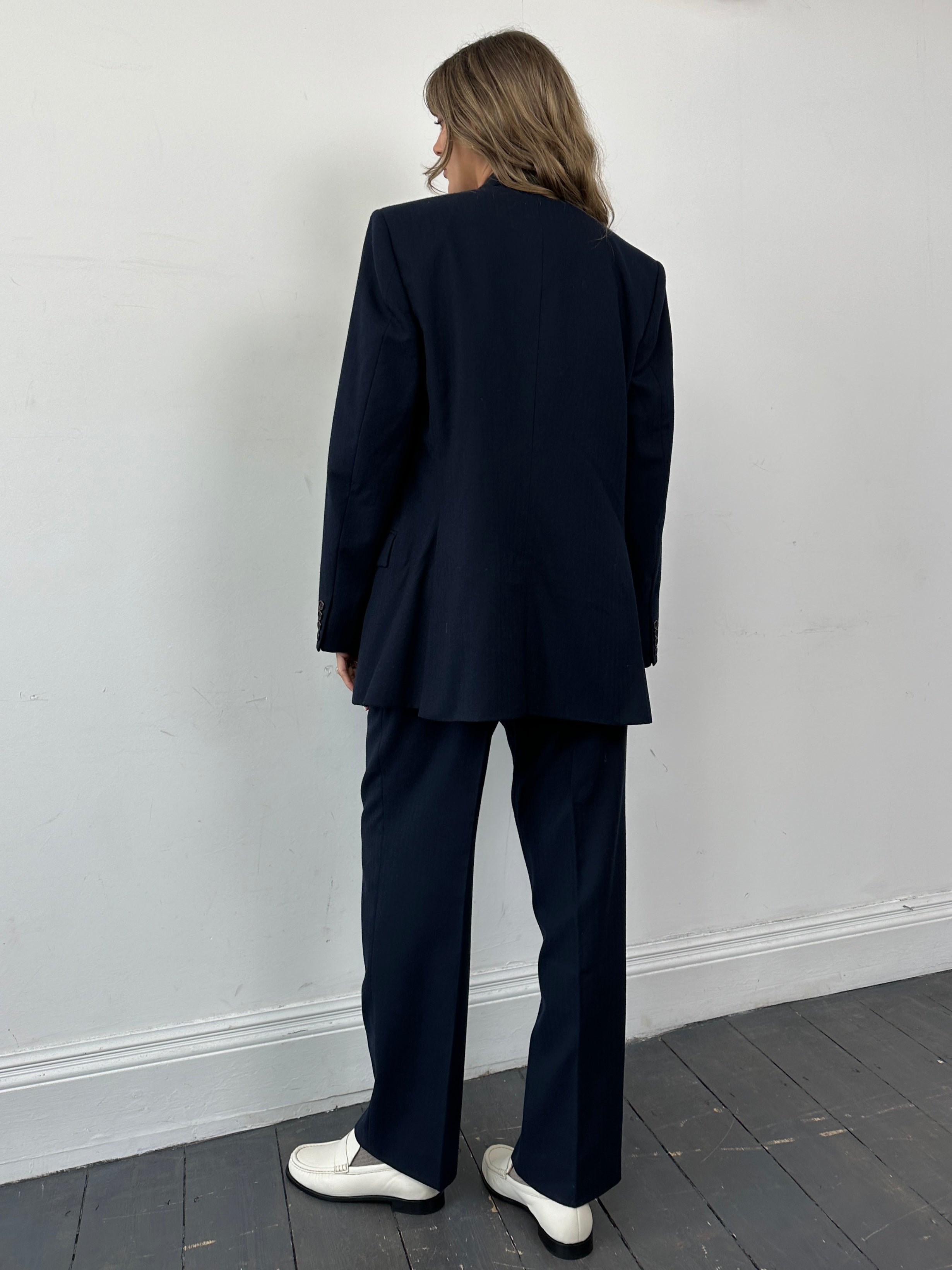 Christian Dior wool double-breasted jumpsuit in size 43R/W32, tailored fit with classic lapels and stylish design.