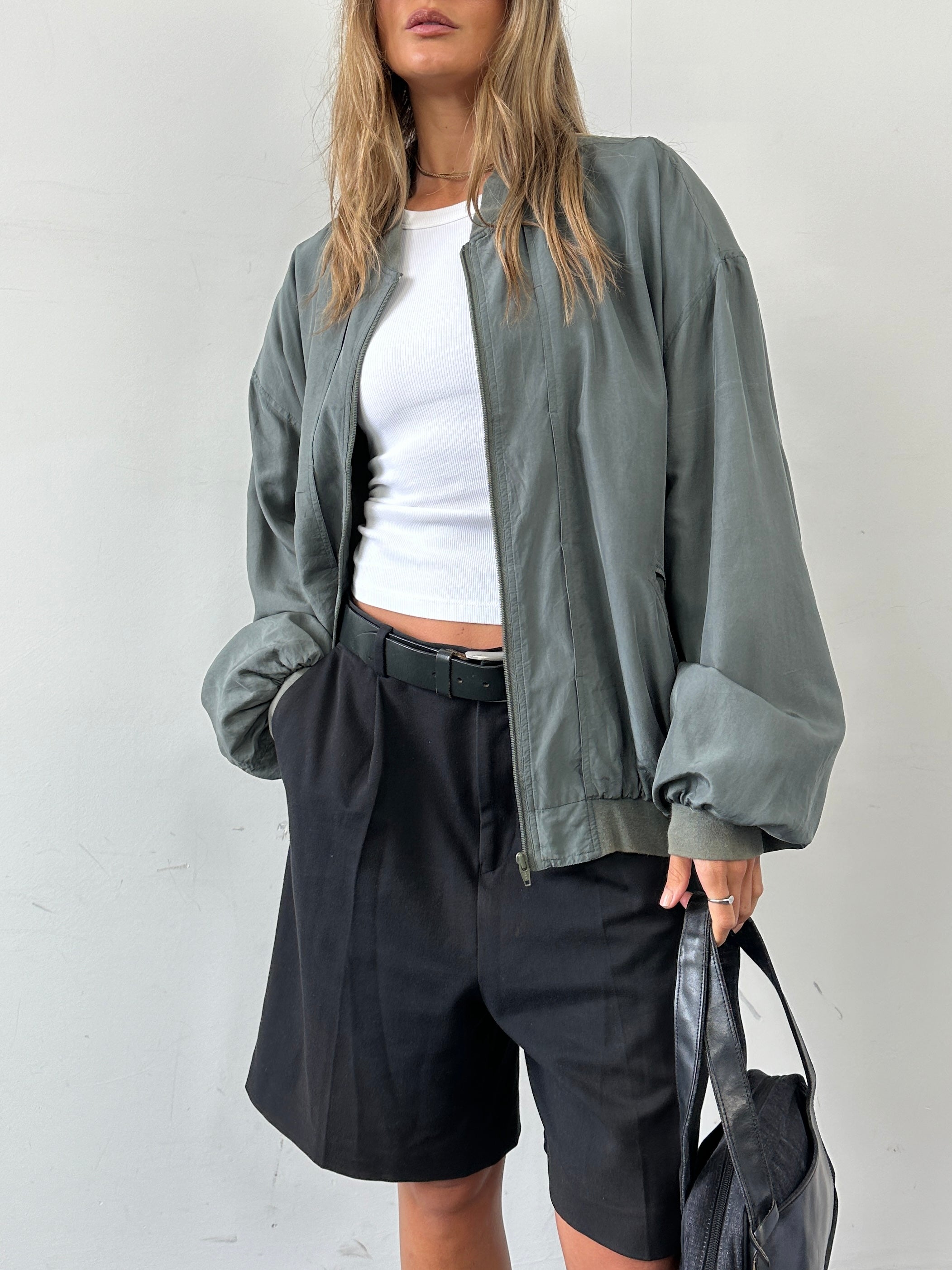 Vintage 80s pure silk bomber jacket in XXL, featuring a classic design with a smooth silk finish and ribbed cuffs.