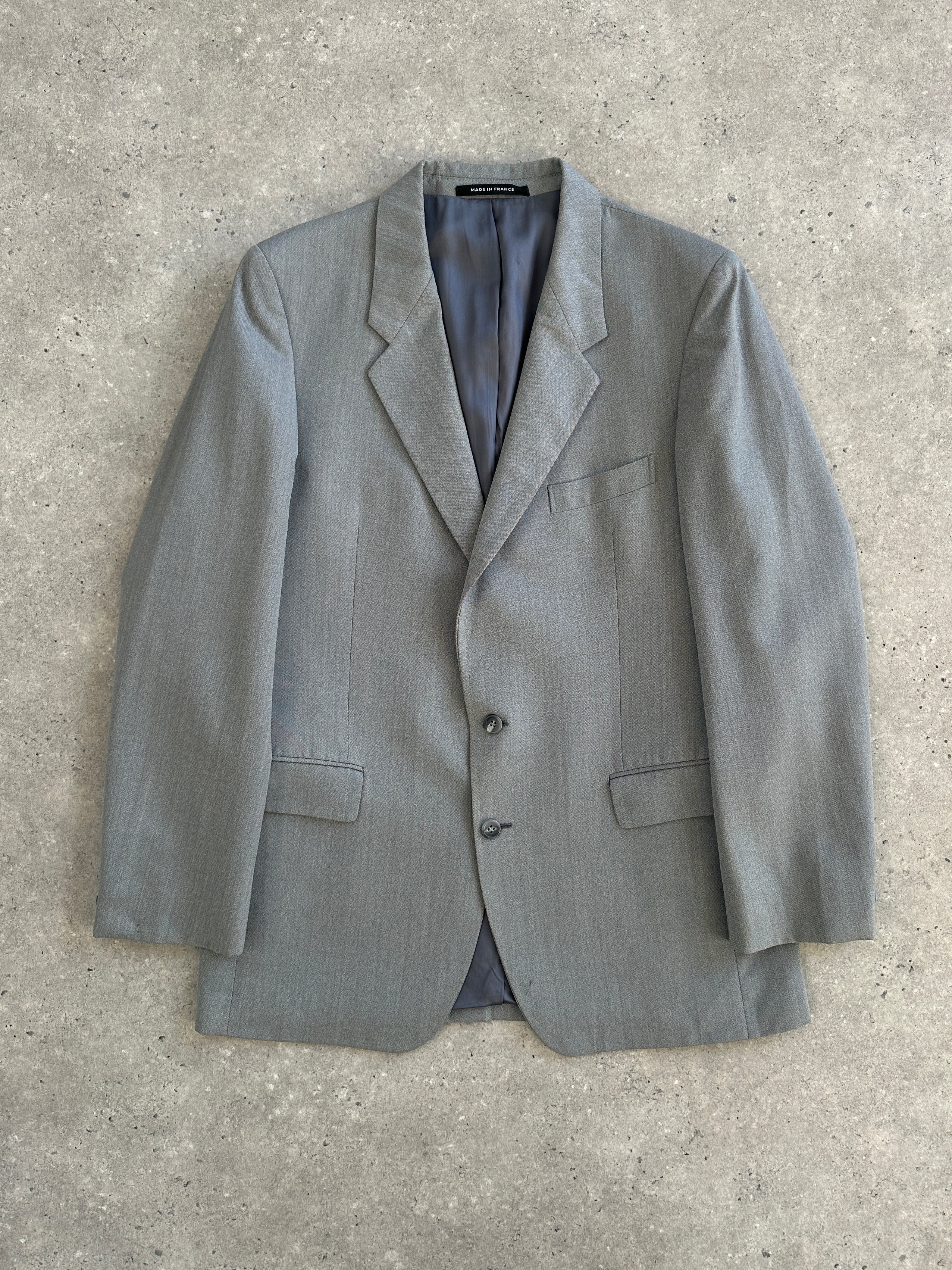 Yves Saint Laurent 1990s pure wool single-breasted blazer in size 40R/L, classic tailored design with lapels and button closure.