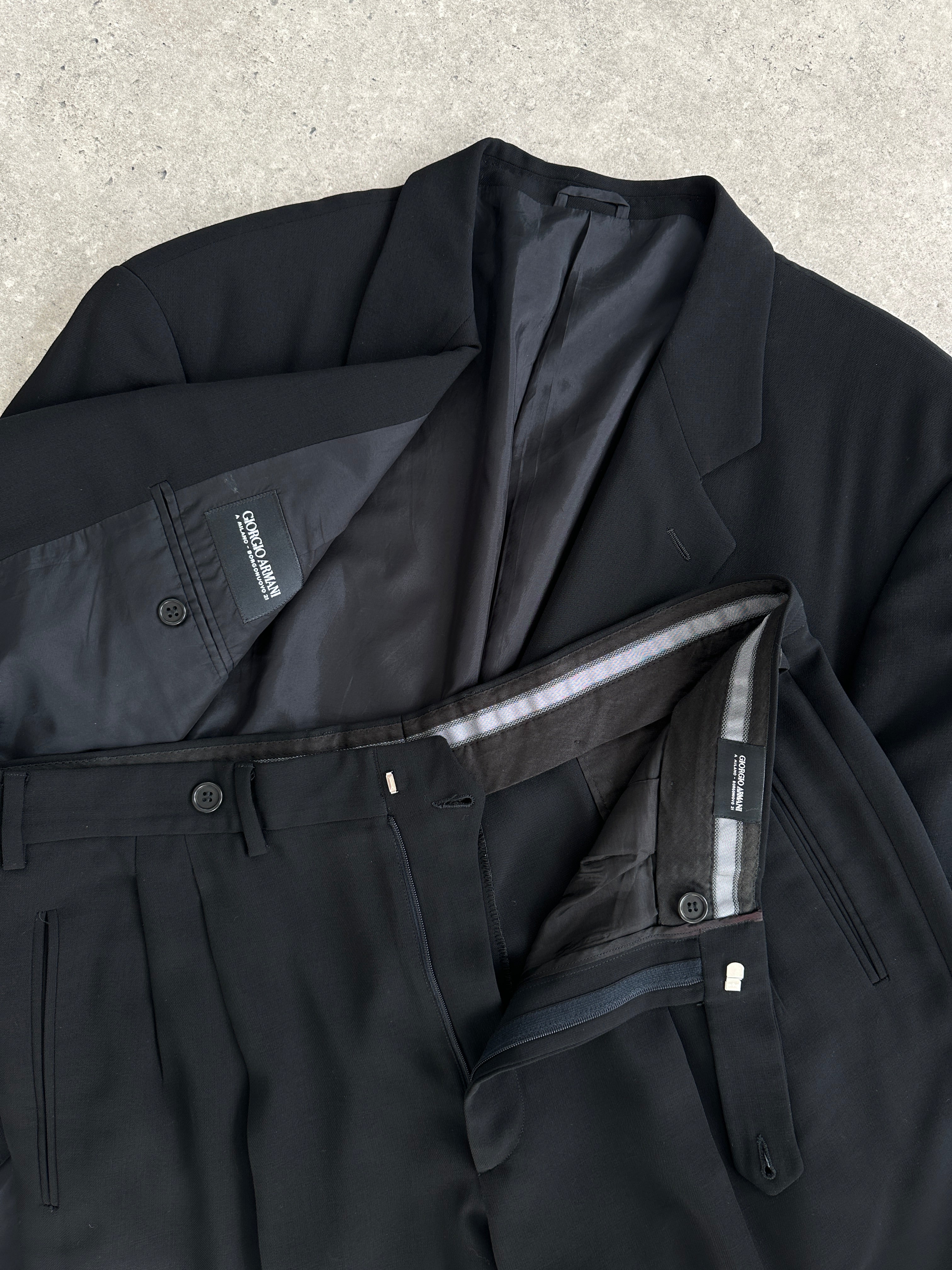 Giorgio Armani oversized pure wool jumpsuit in 44R/W36, relaxed fit with a tailored, modern design, shown on a hanger.