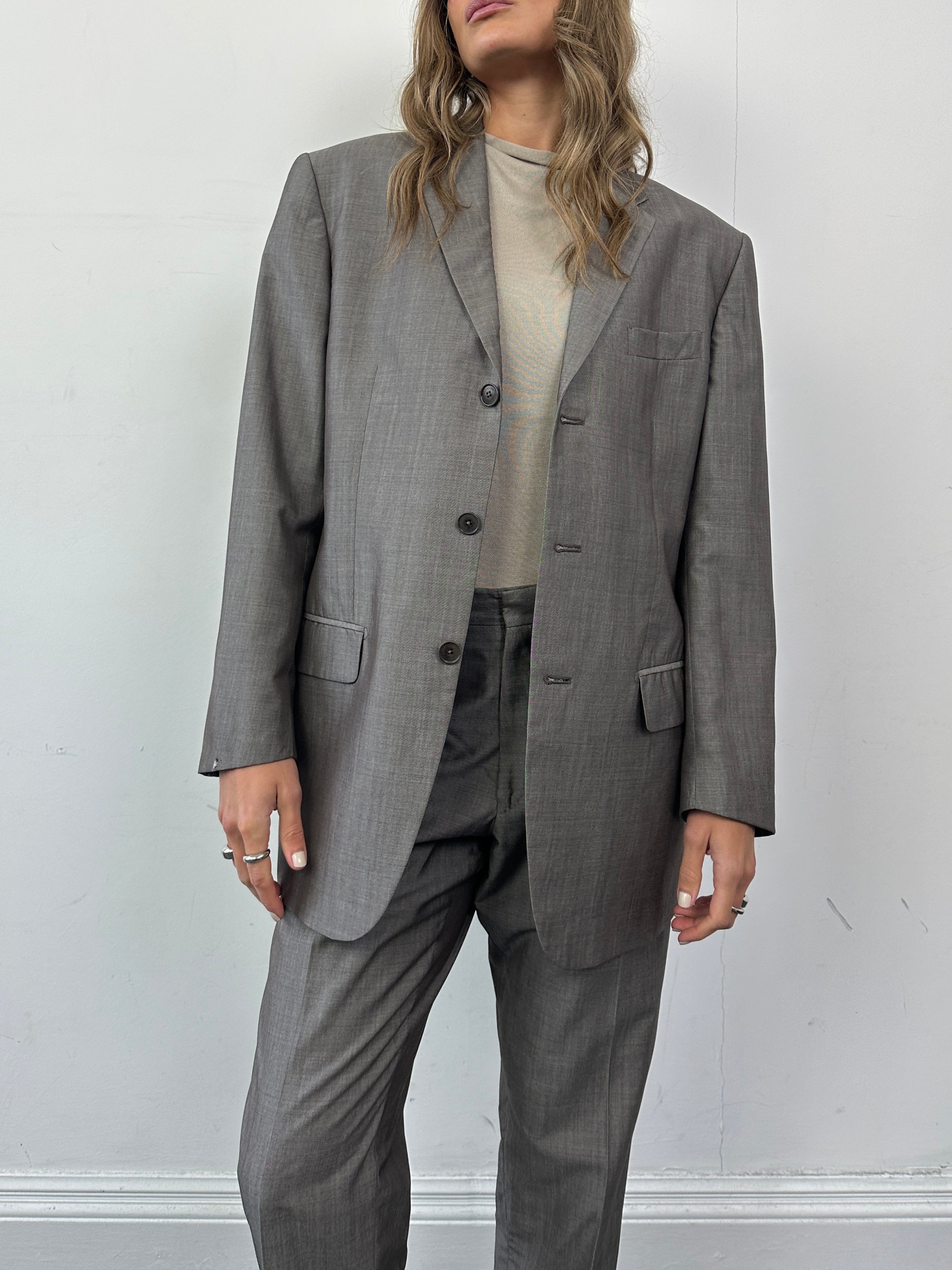 Elegant Valentino virgin wool silk single-breasted jumpsuit in size 42R/W32, featuring tailored fit and sleek design.