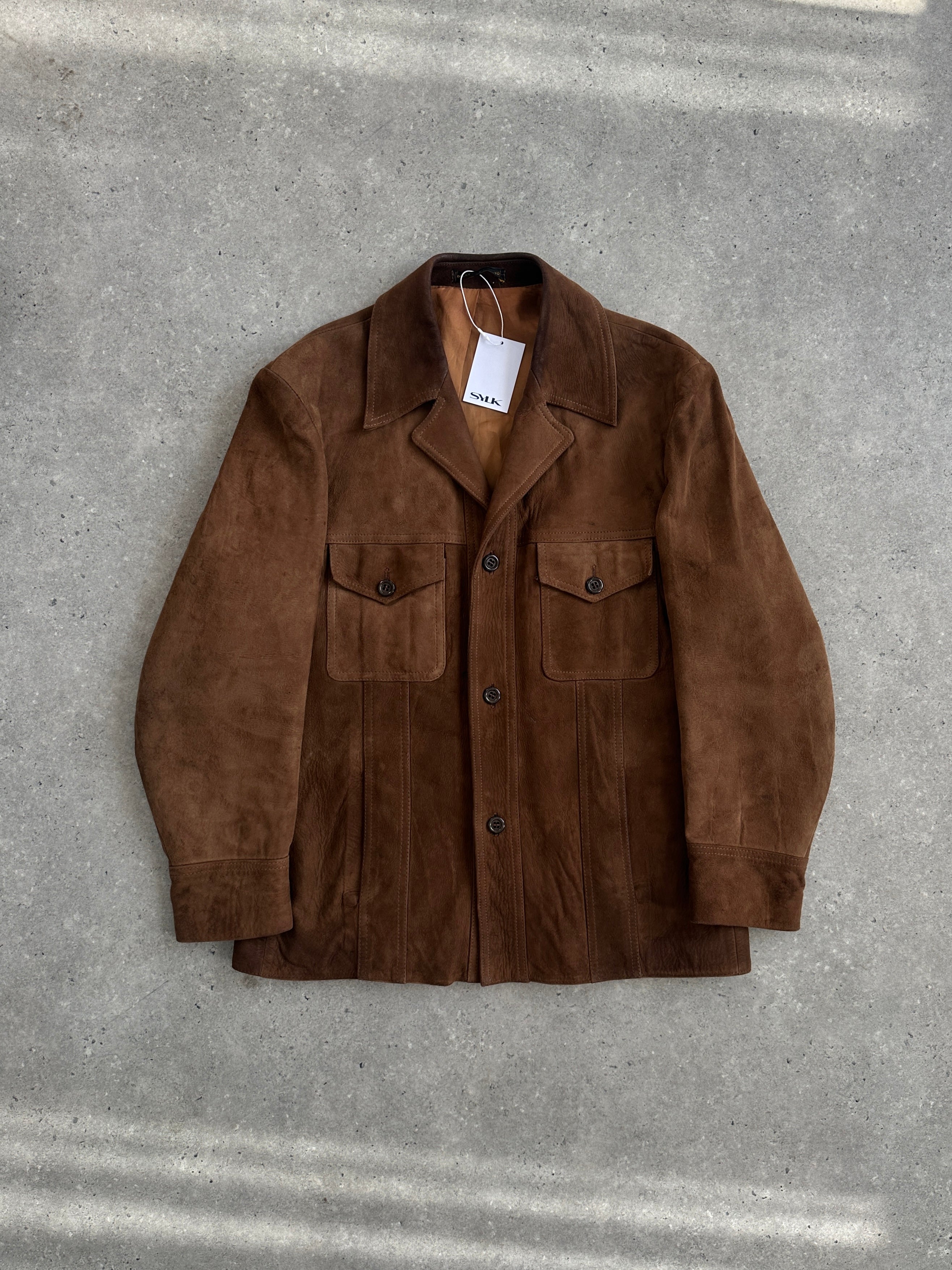 Vintage British 70s suede leather trucker jacket, size large, featuring classic collar and rugged style.