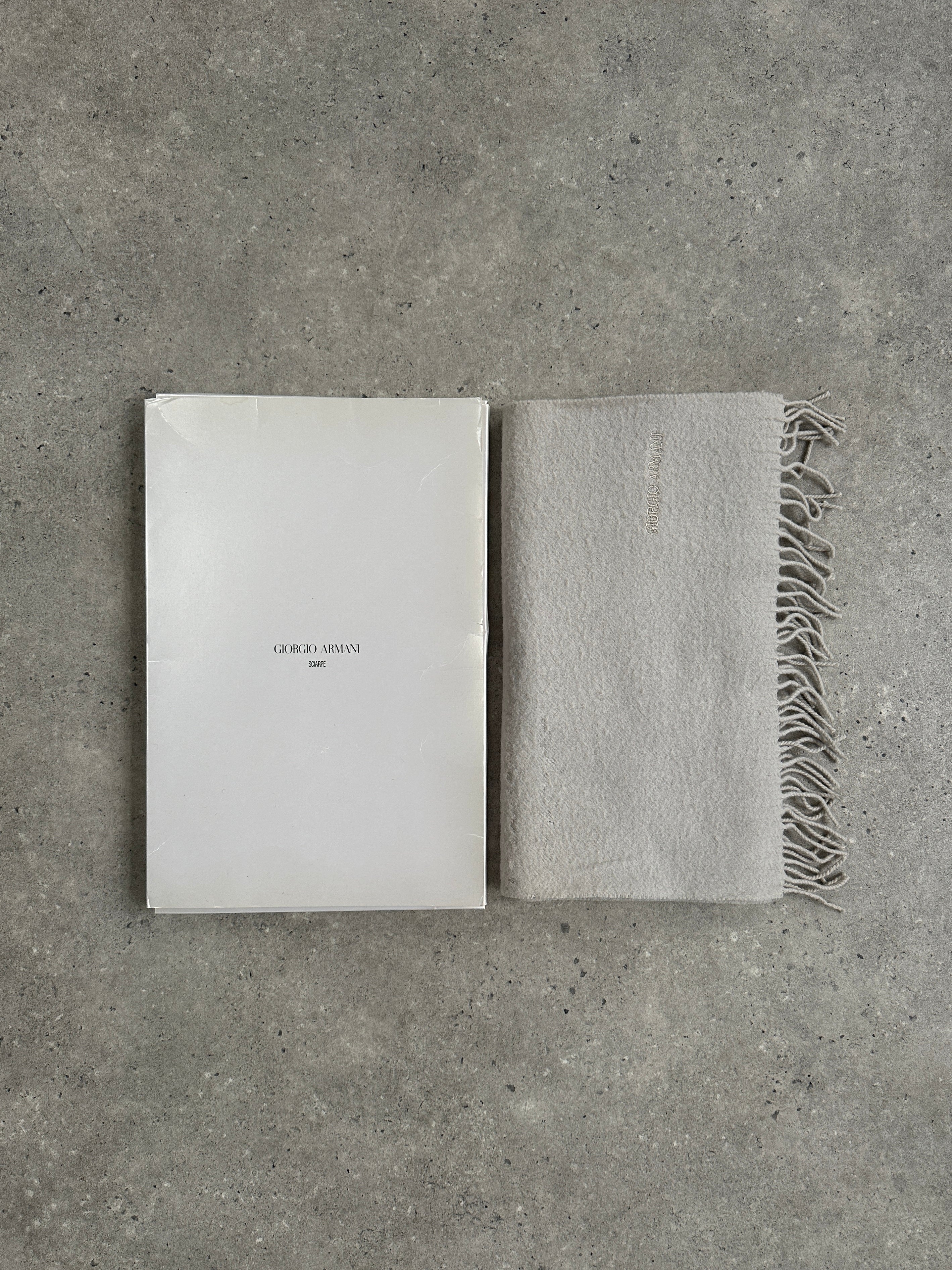 Giorgio Armani Le Collezioni 2000s pure wool logo scarf with subtle Armani branding and classic design, displayed flat.