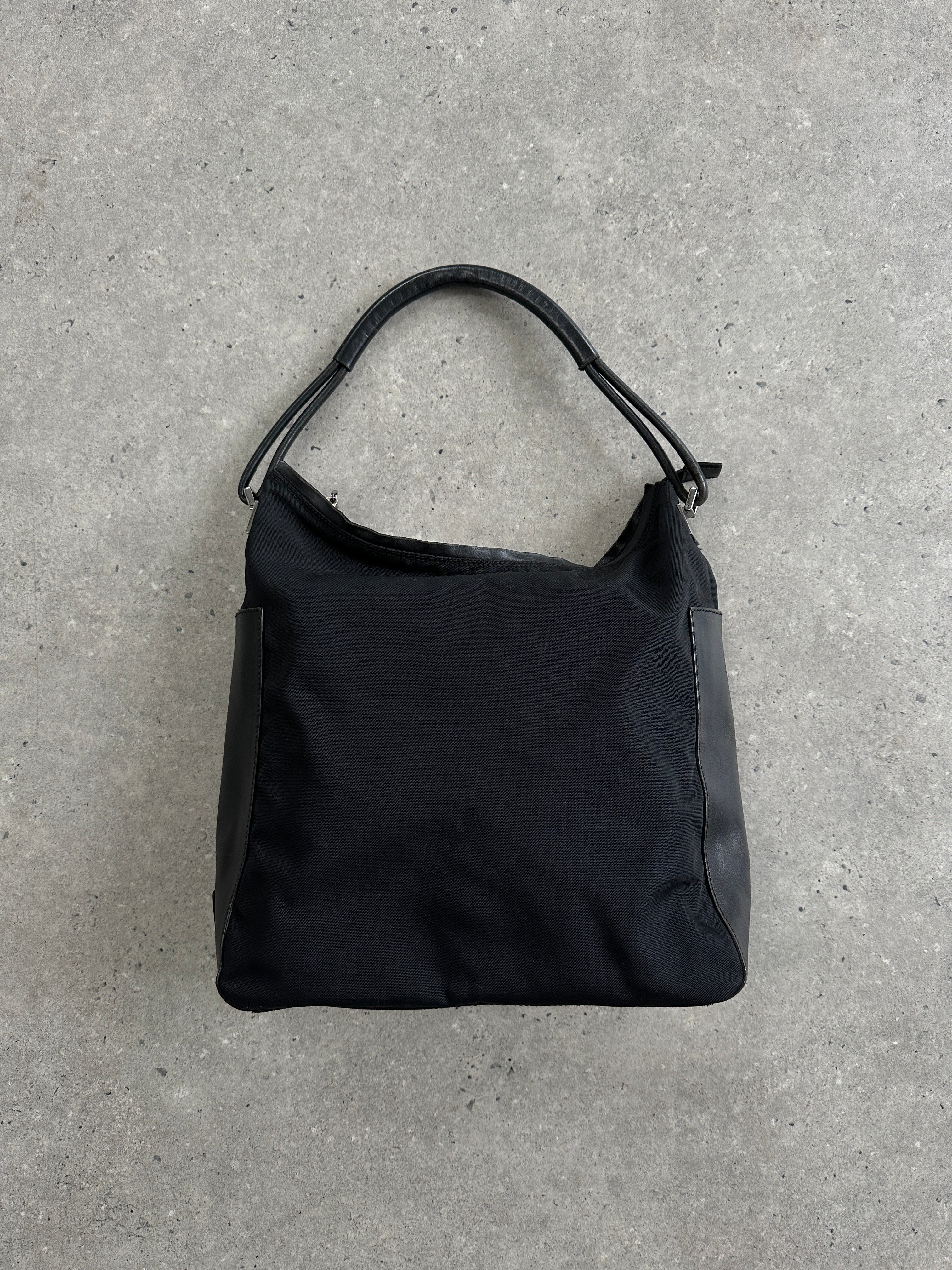 Gucci 1990s Tom Ford canvas and leather hobo shoulder bag with stylish design and spacious interior.